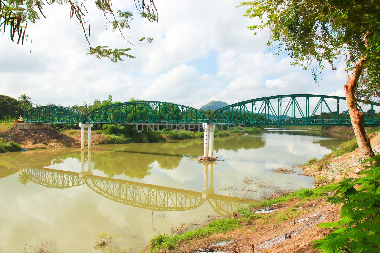 Ancient bridge over the river in Thailand