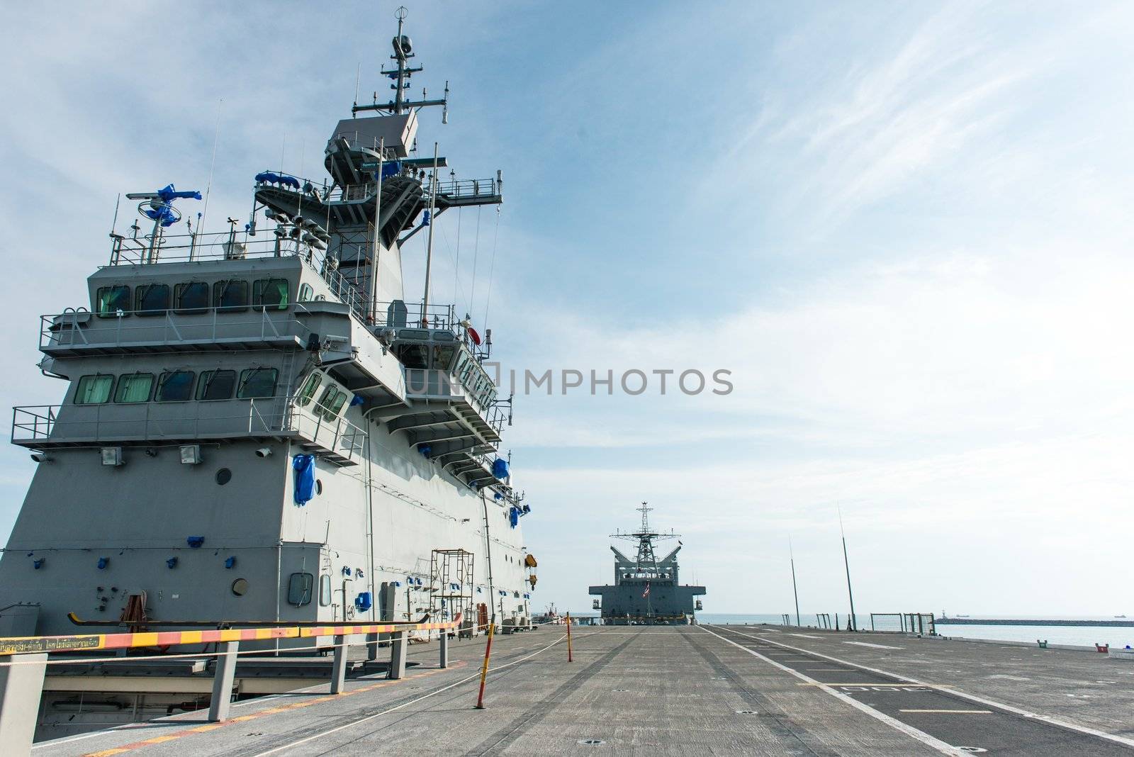 Large battle ship in Naval base, taken on a sunny day