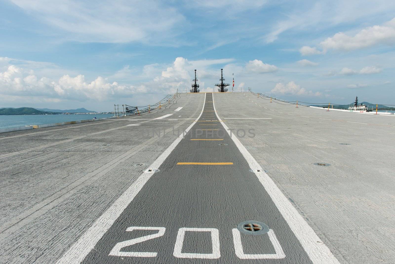 Concrete fighter jet run way of an aircraft carrier, taken on a sunny day in Thailand