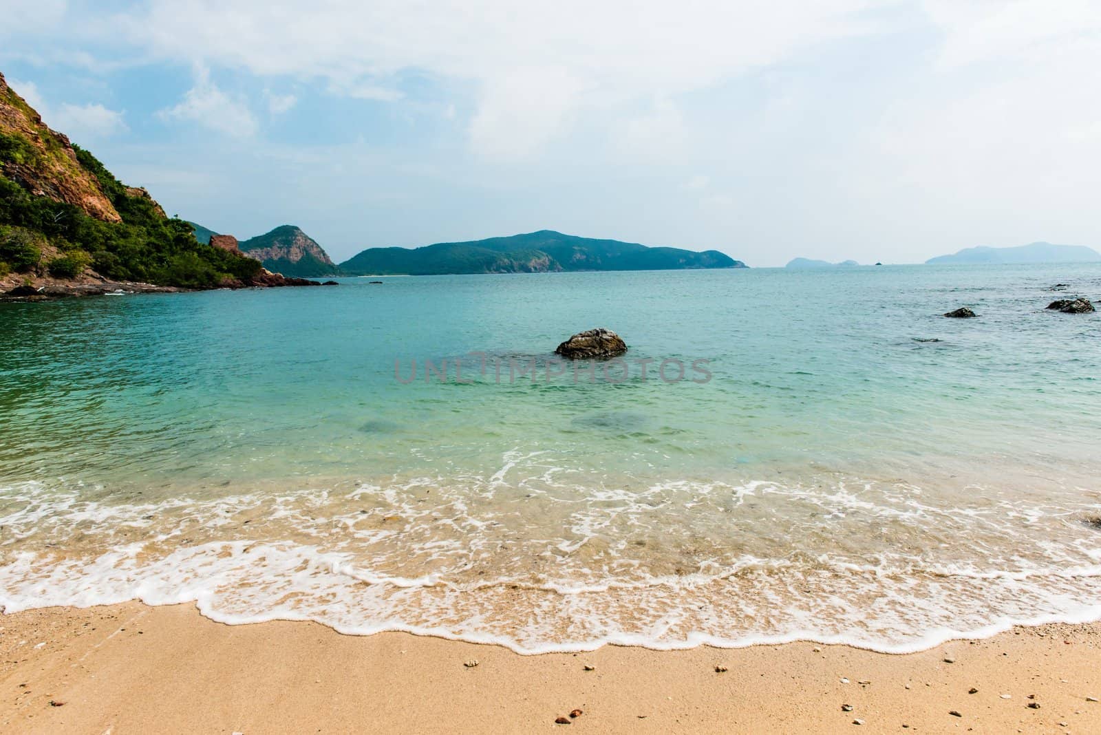 Beautiful beach on the gulf of Rayong, Thailand, taken on a sunny day.