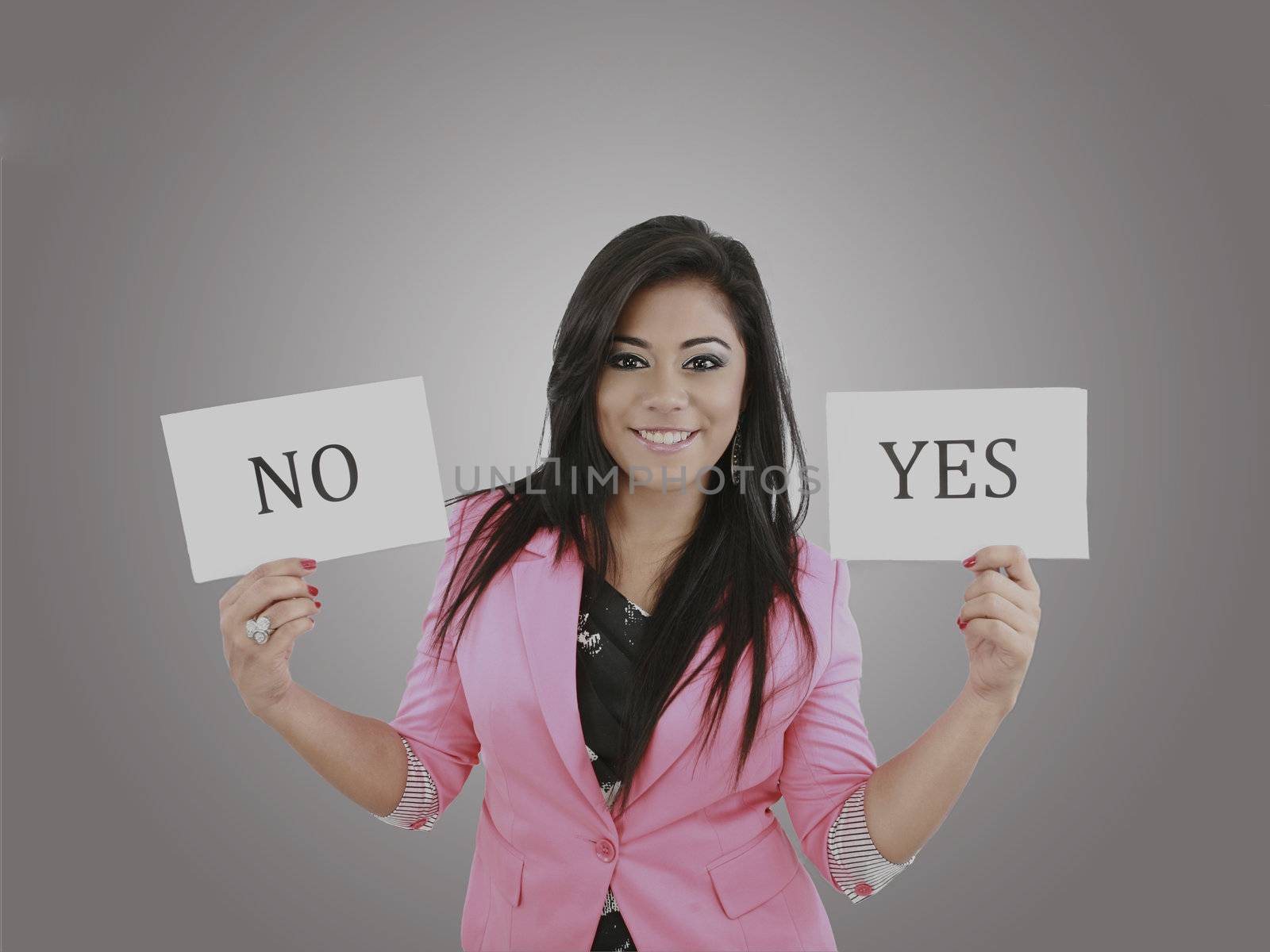 Business young woman trying to make a decision between Yes or No by dacasdo