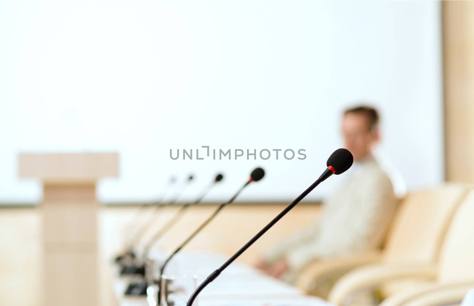 close-up microphone, on the background of business communication at the conference