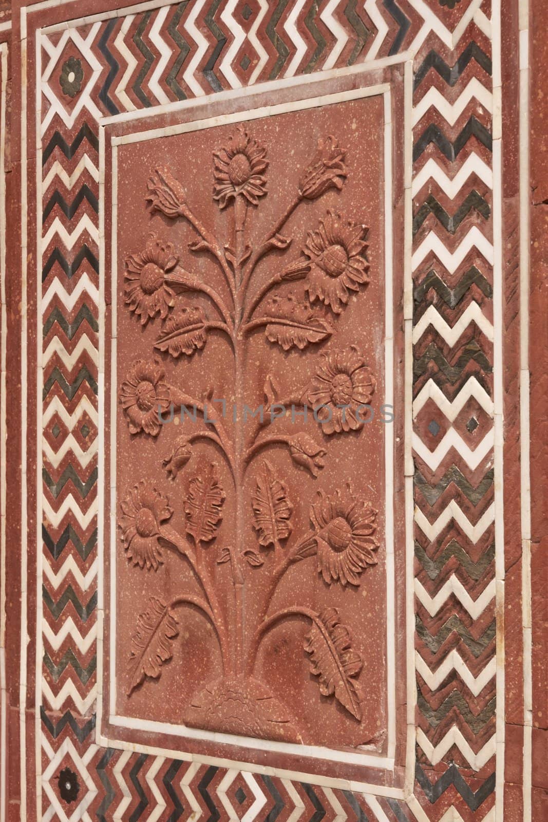 Detail of decoration on the mosque at the Taj Mahal. Mughal style building of red sandstone inlaid with marble. Agra, Uttar Pradesh, India