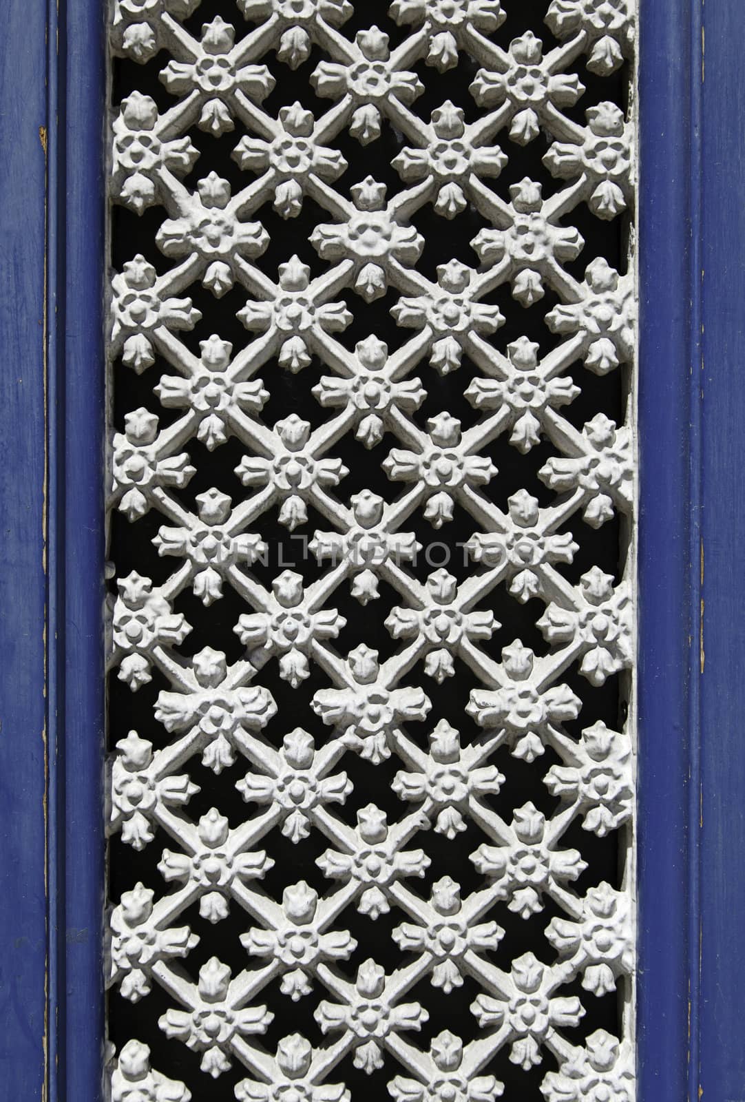 Old fence in a window, detail of a window in the city of Braga, Portugal, Europe