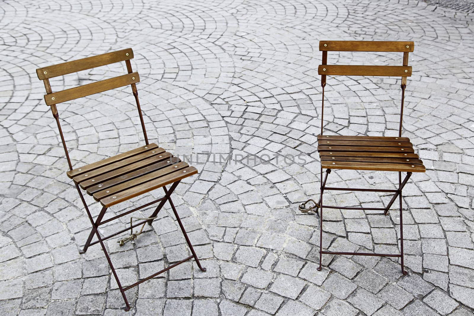 Chairs in the park, two chairs in a square in a town of Portugal, Europe