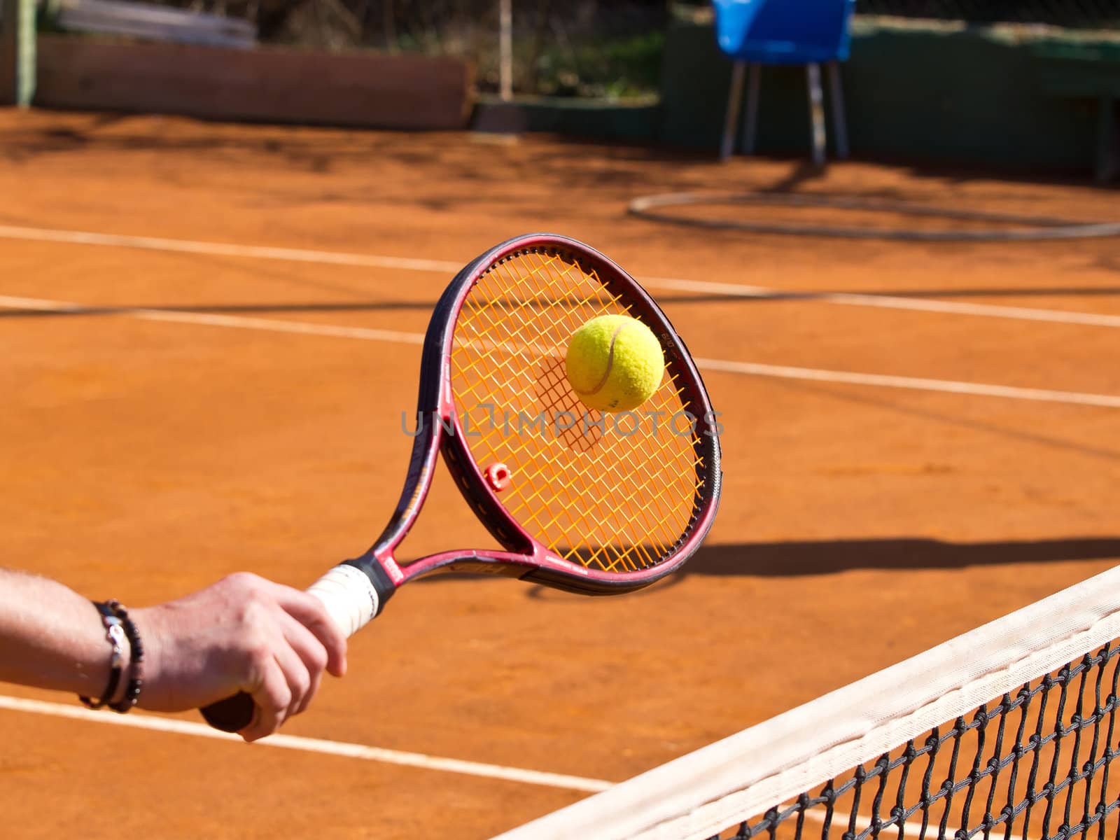 tennis racquet and the ball