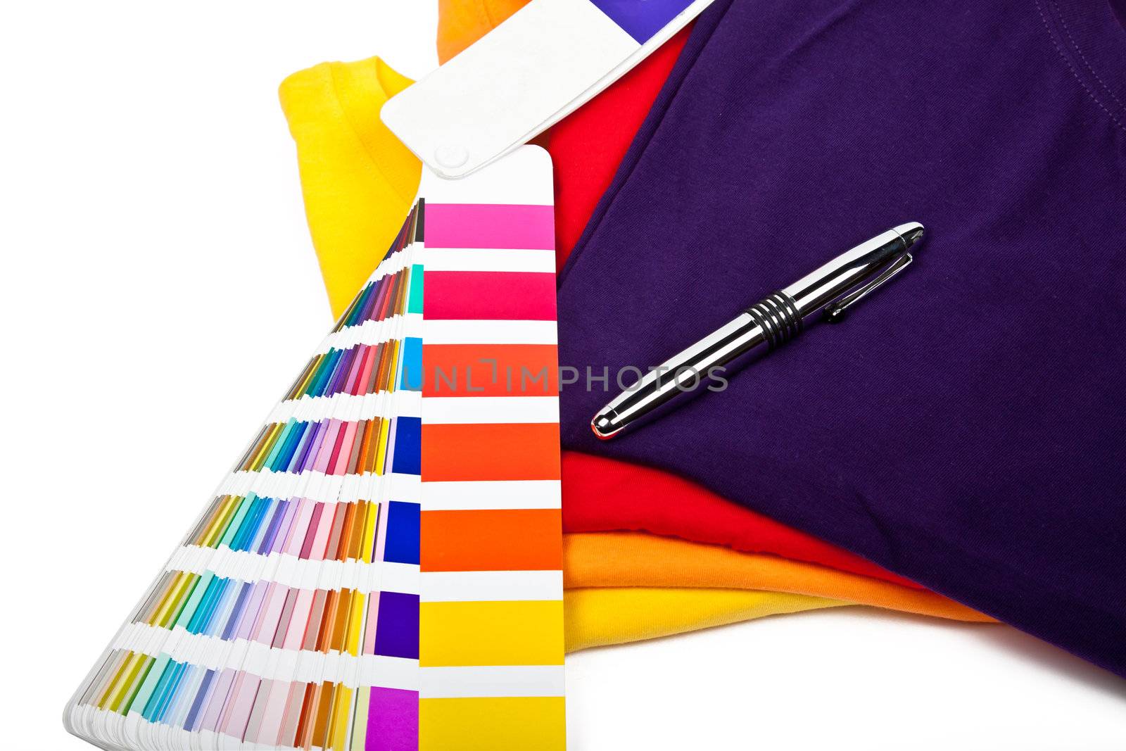 colorful t shirts, color chart and ballpoint pen