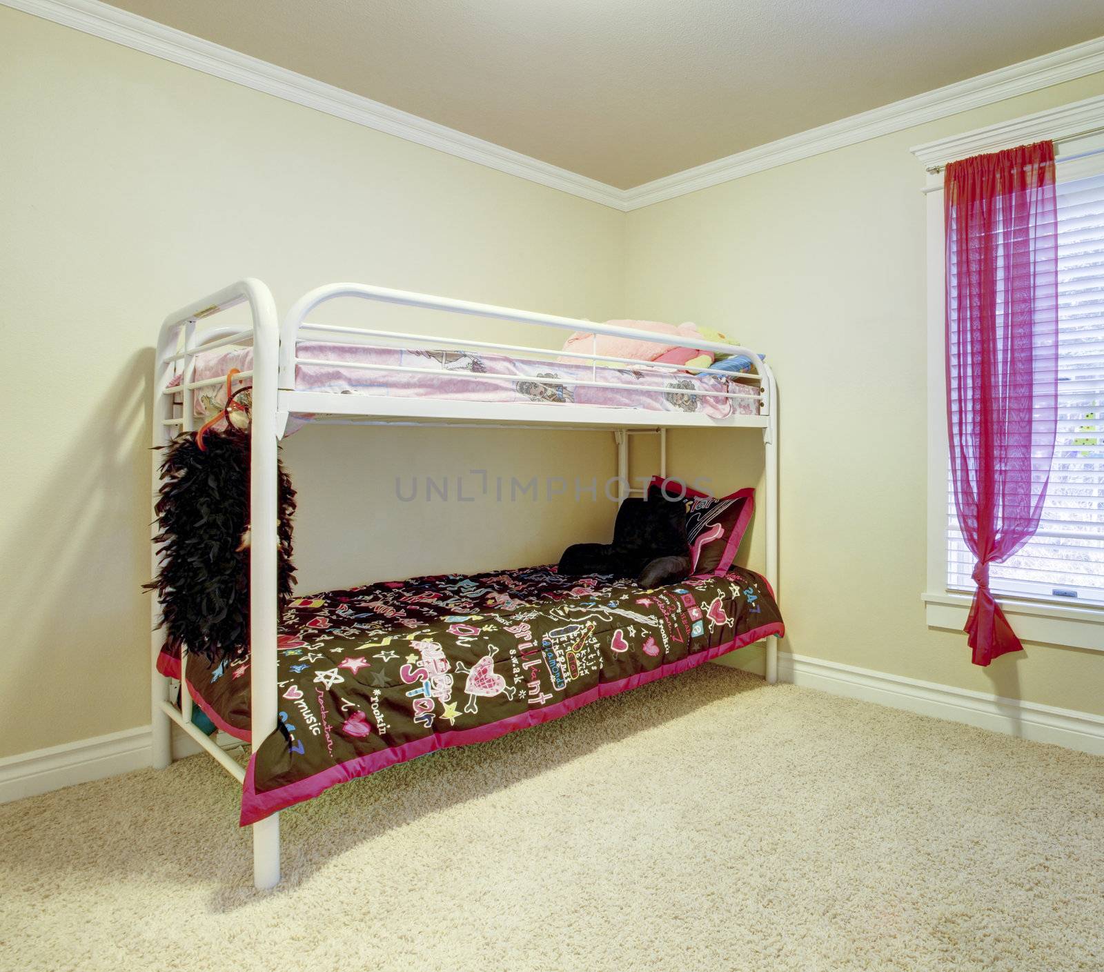 Kids simple bedroom with double bunk metal bed.