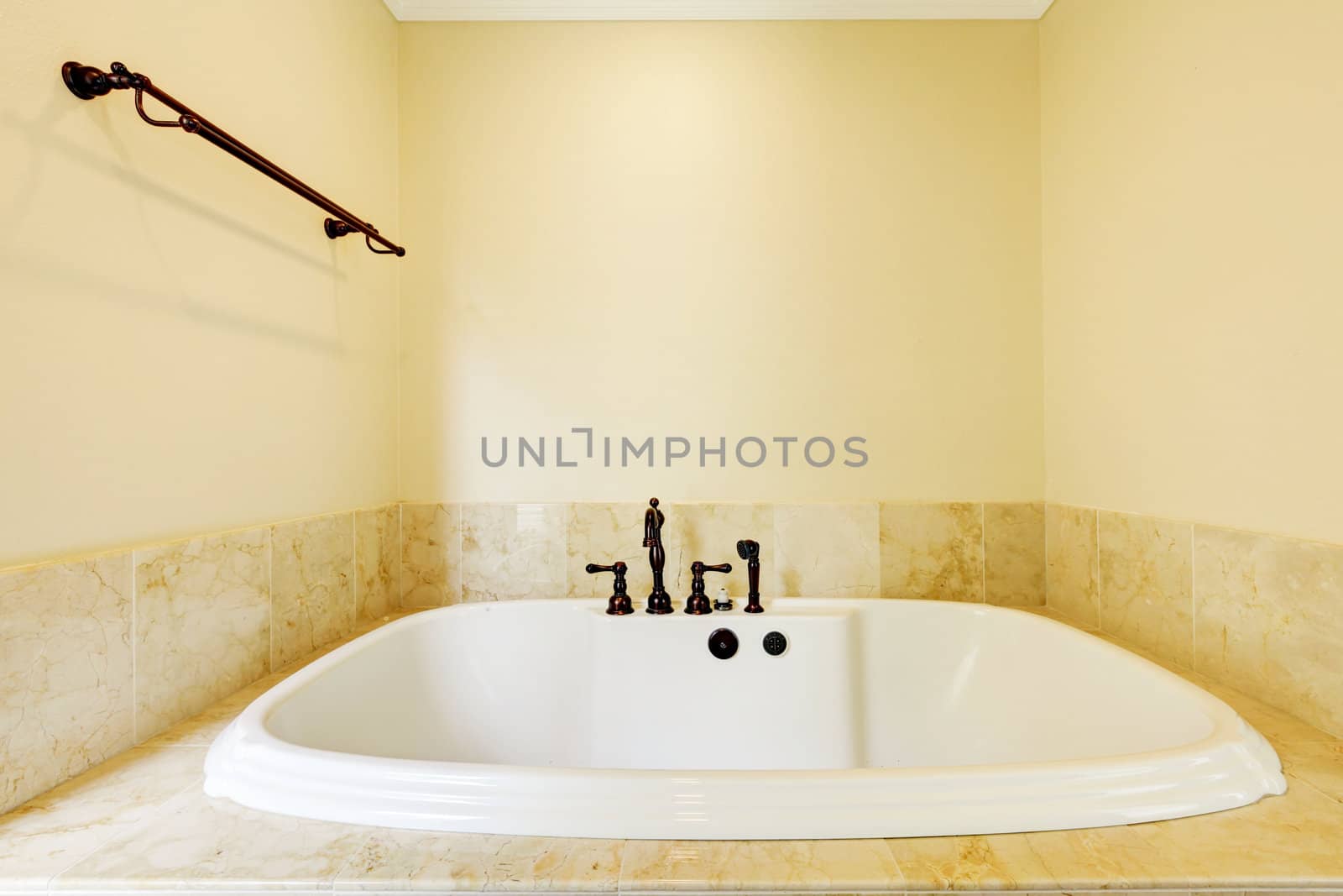 Nice new empty bathroom with large white tub