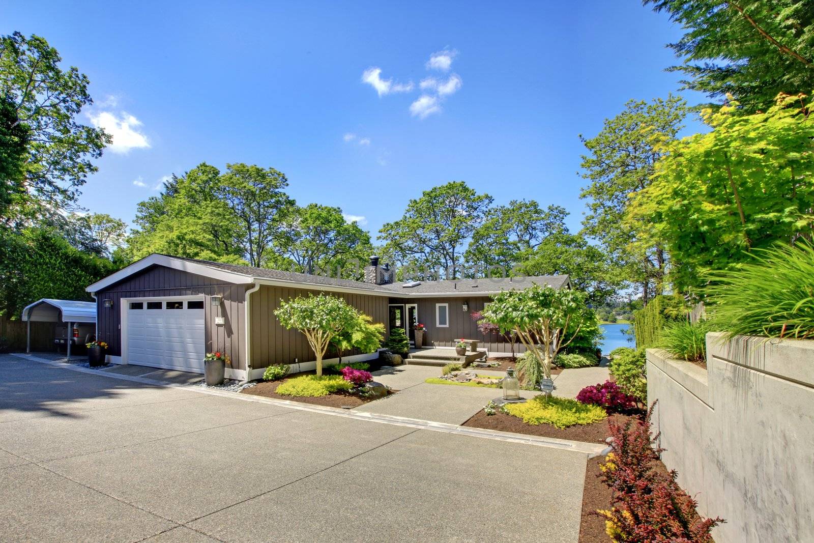 Beautiful home with garage, lake view and large front yard.