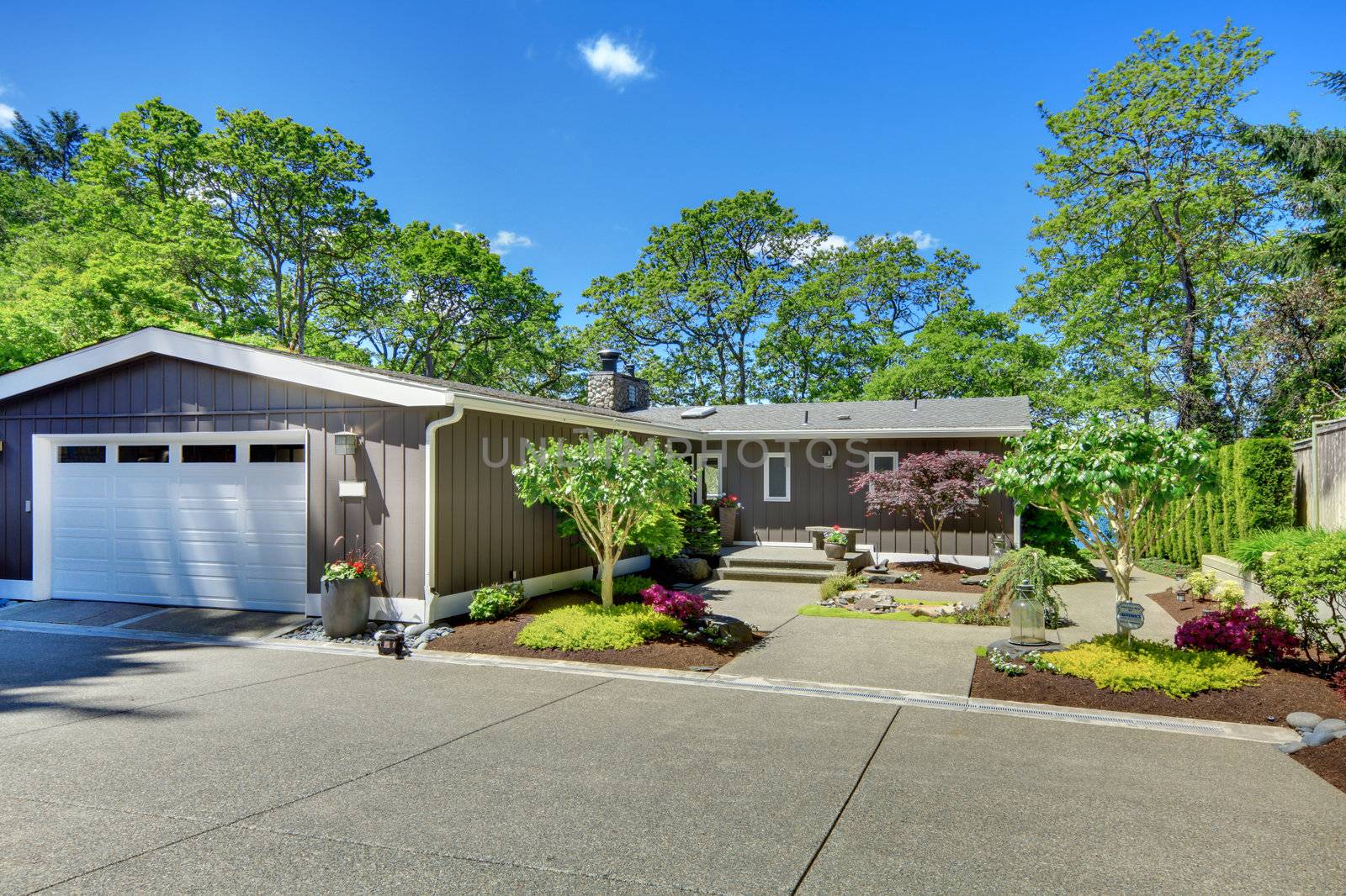 Beautiful home with garage, lake view and large front yard.