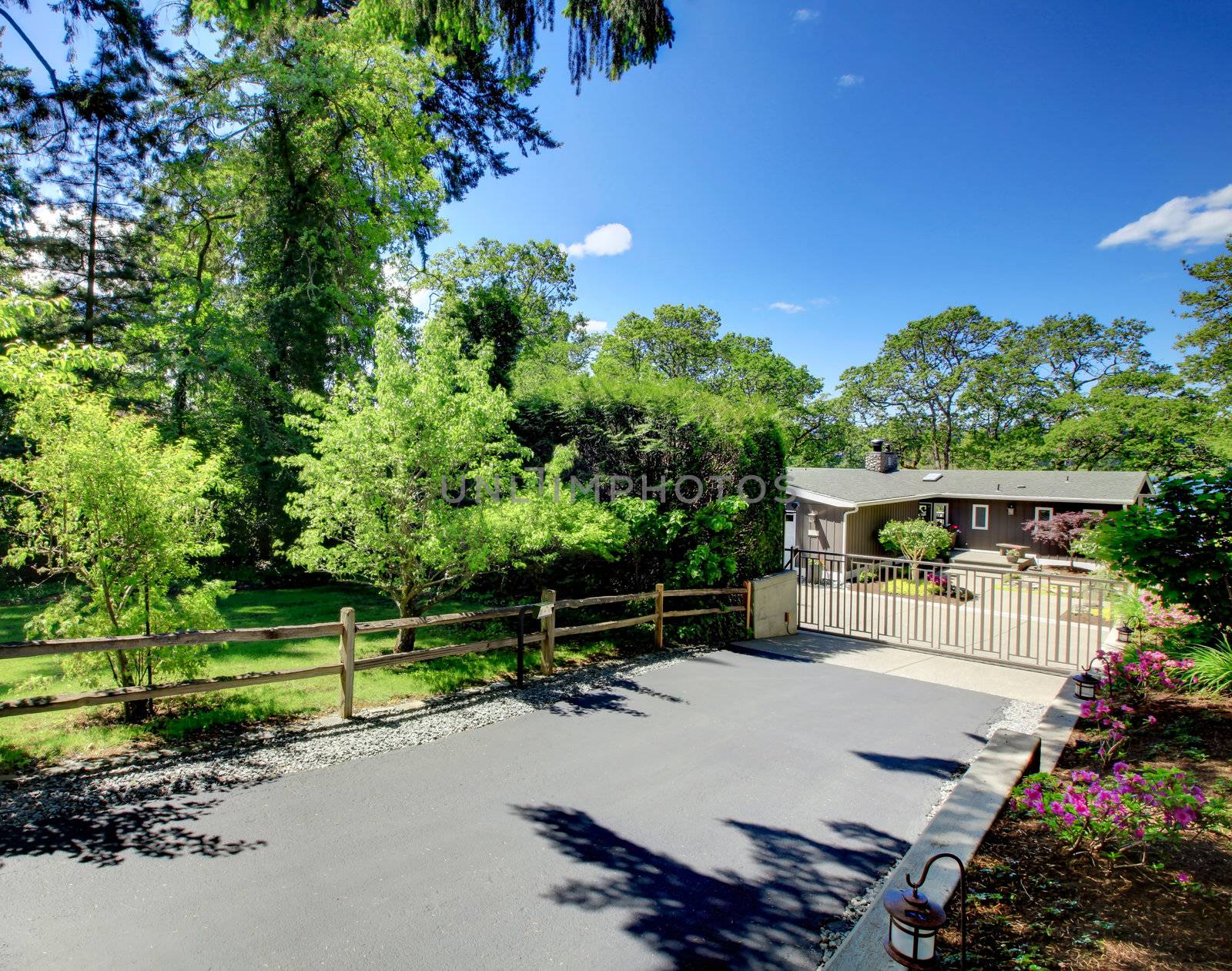 Beautiful home with private gates, driveway and garden.