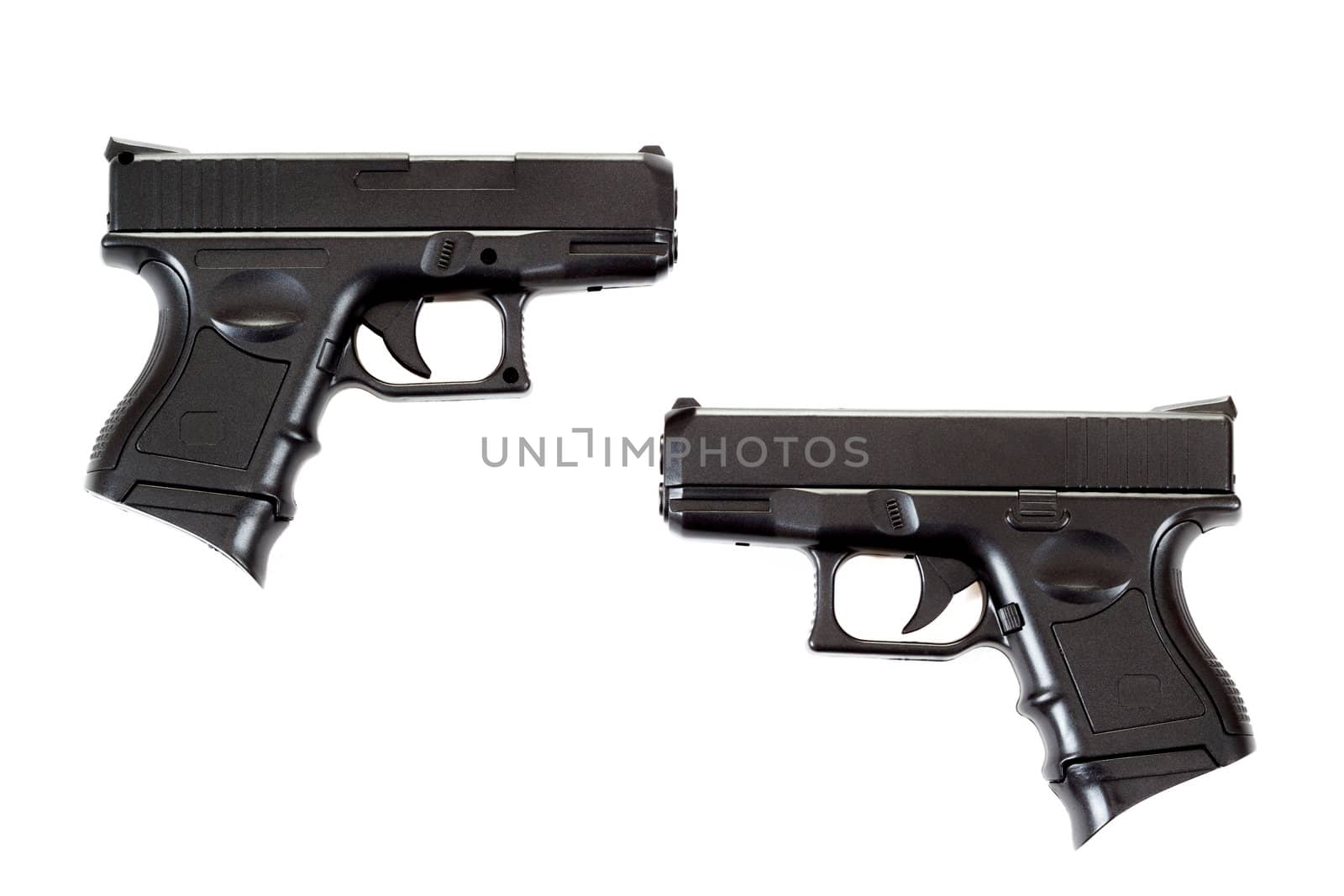 Black airsoft guns isolated on white background 