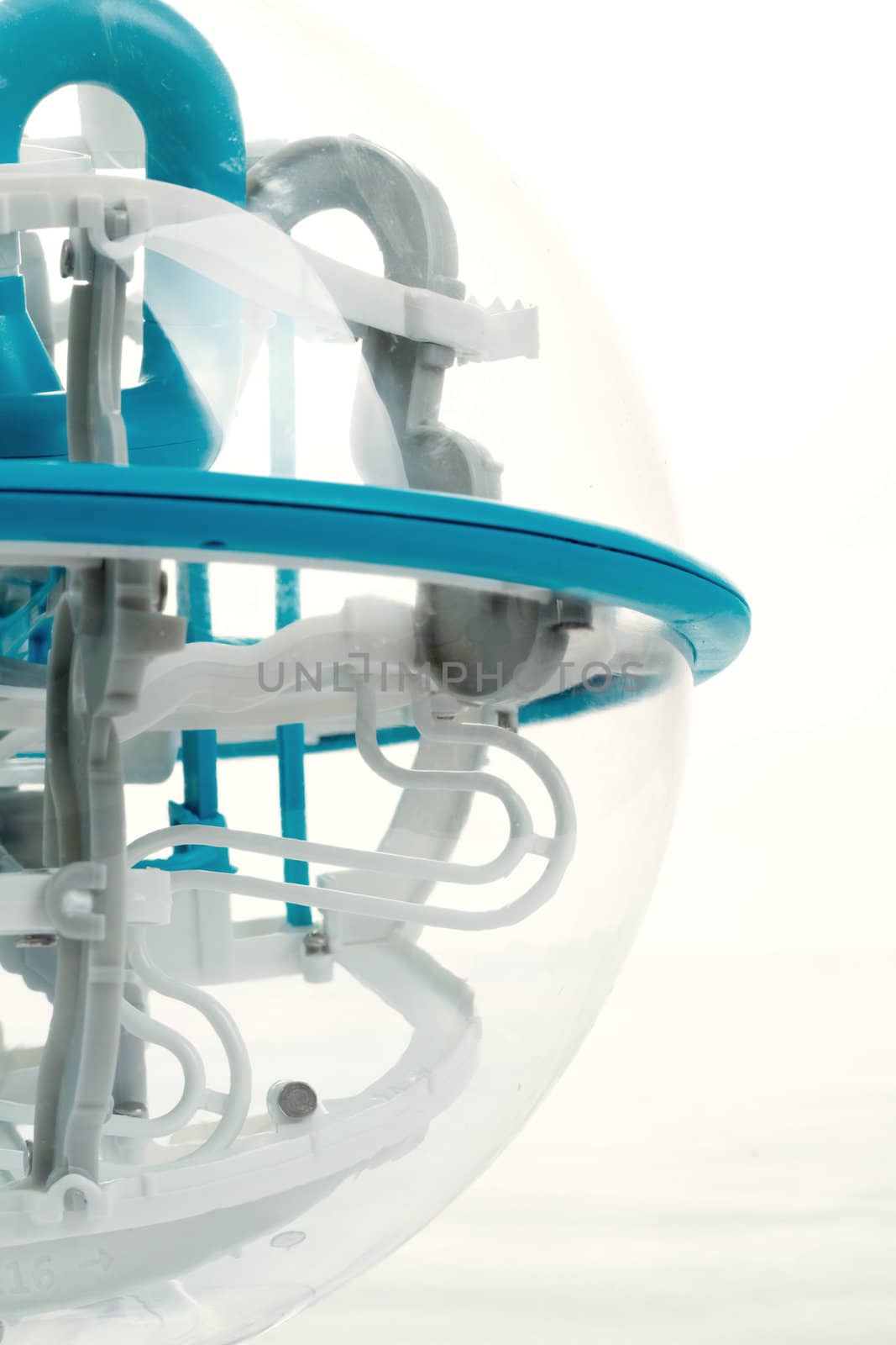 detail of 3D labyrinth ball, game on white background