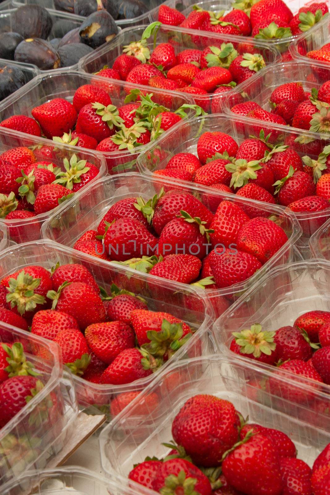 Strawberries at the market by Kartouchken