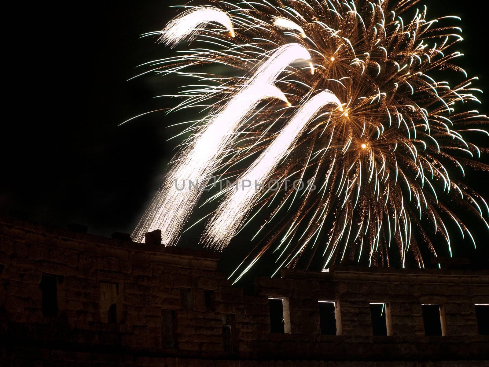 fireworks in summer night over arena