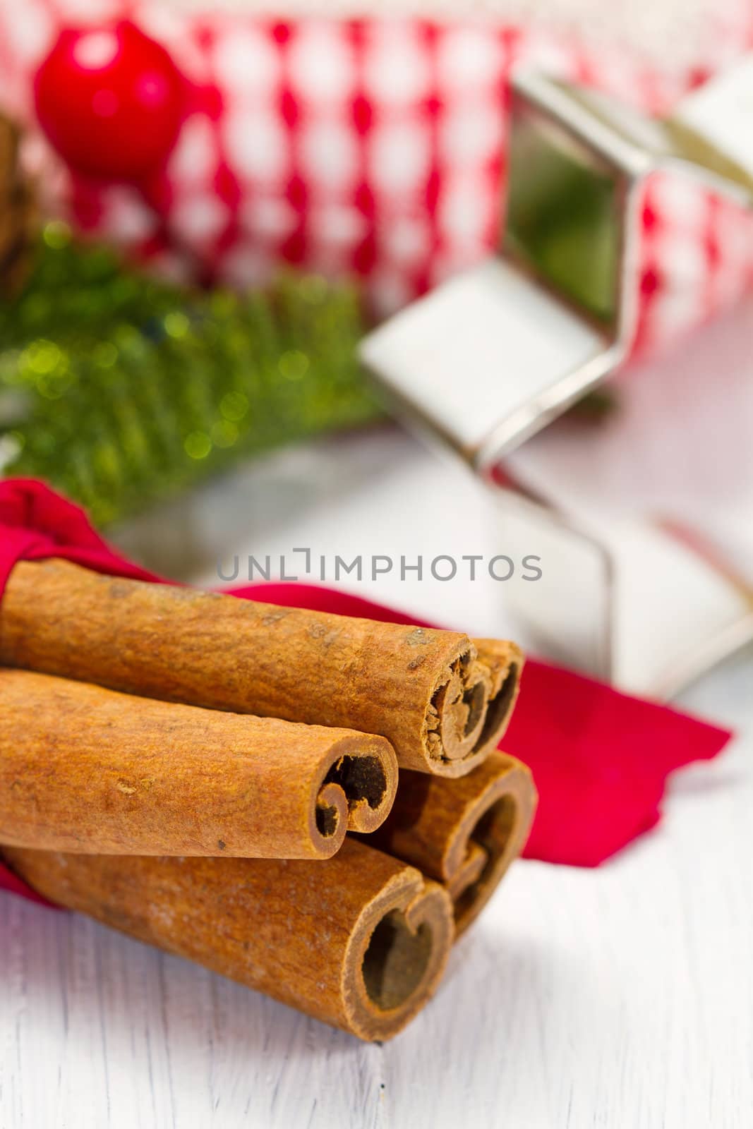 cinnamon sticks with decoration on white