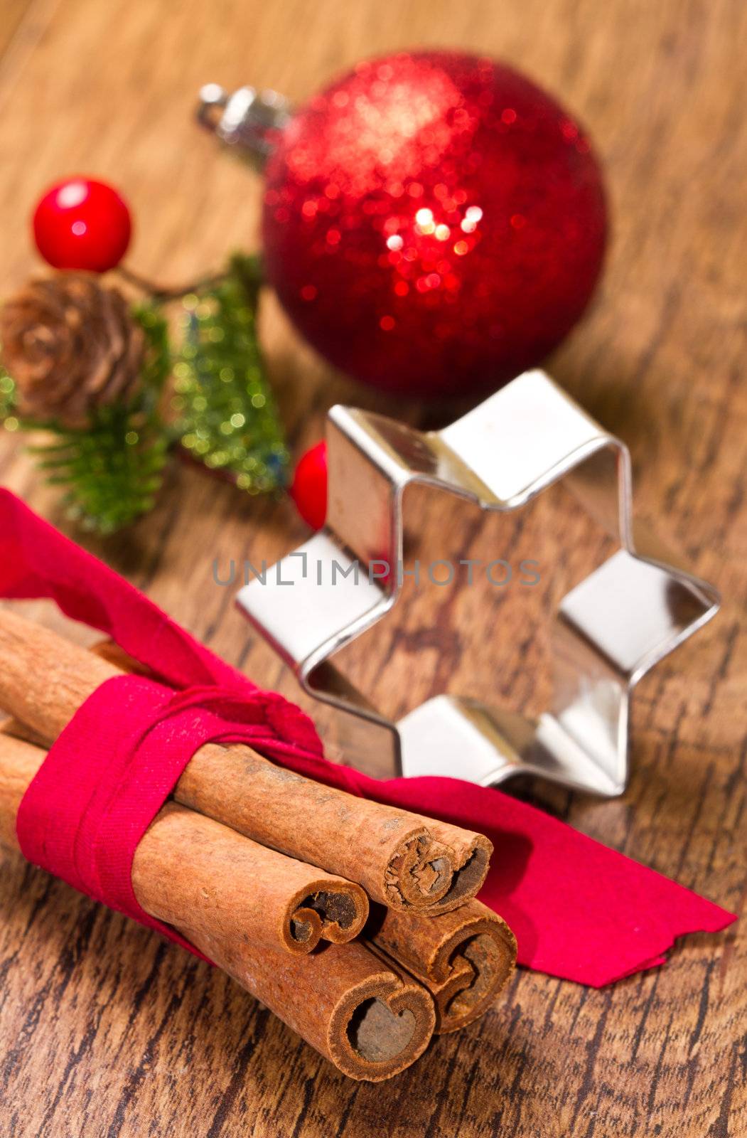 cinnamon sticks with decoration on wooden background