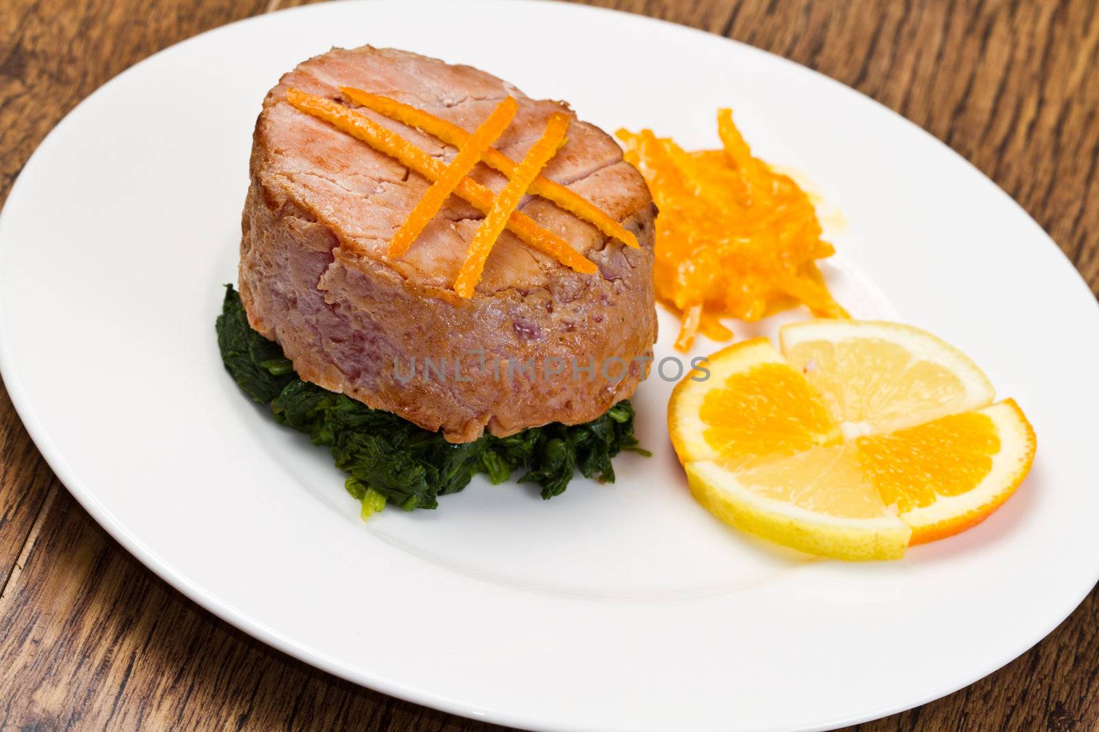 fried tuna fillet with fresh orange ,orange sauce and spinach by lsantilli