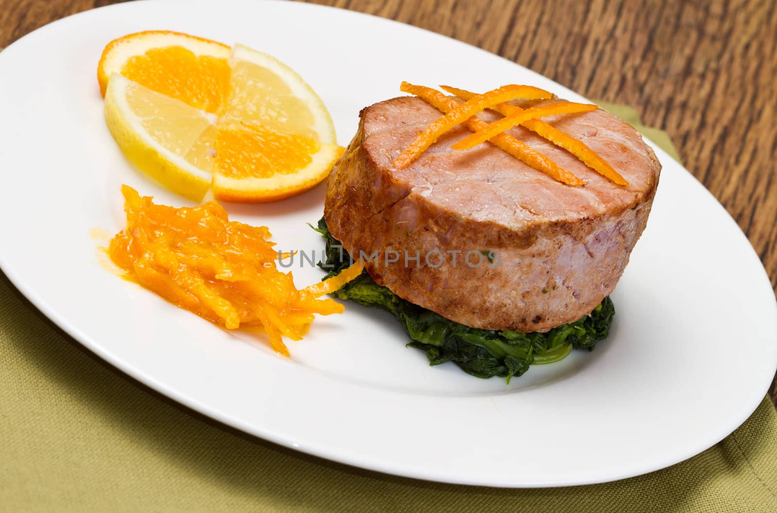 fried tuna fillet with fresh orange ,orange sauce and spinach