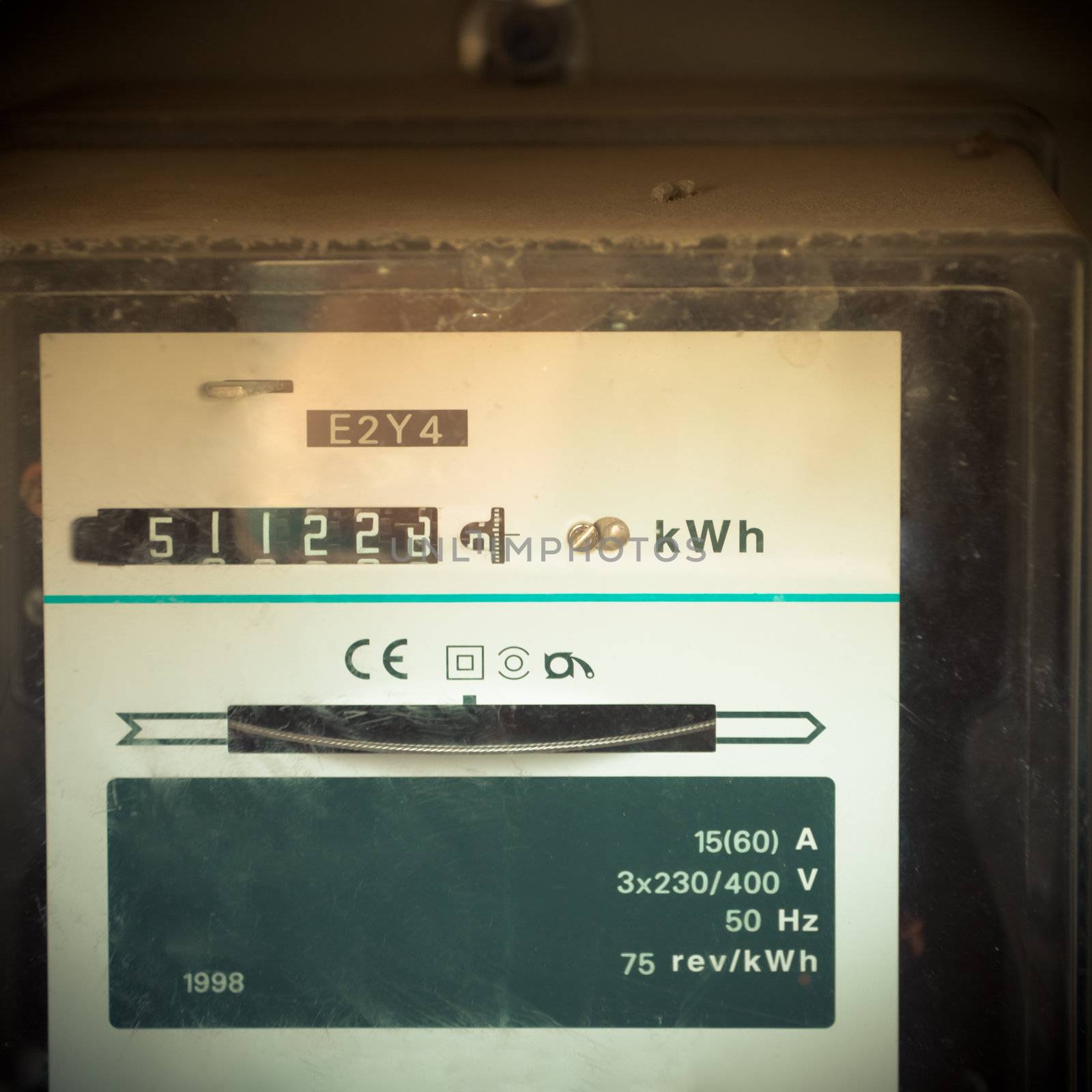 Moble photography lo-fi styled image of old fashioned analog residential power supply meter