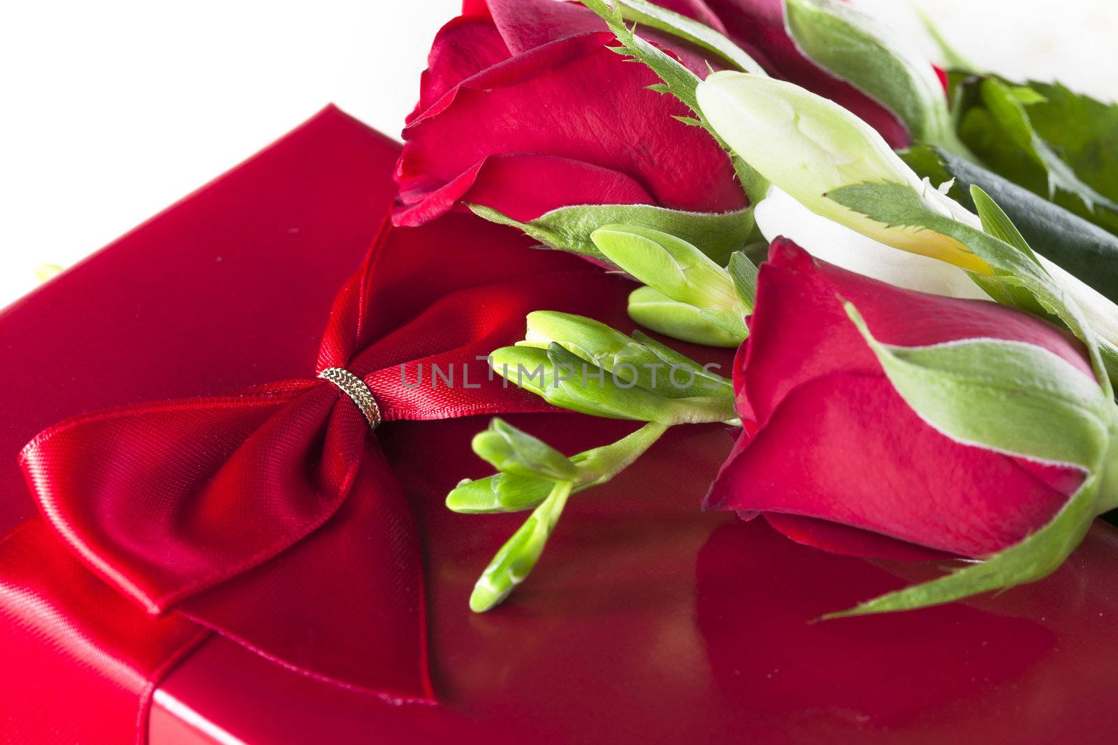 Romantic red gift with red roses.