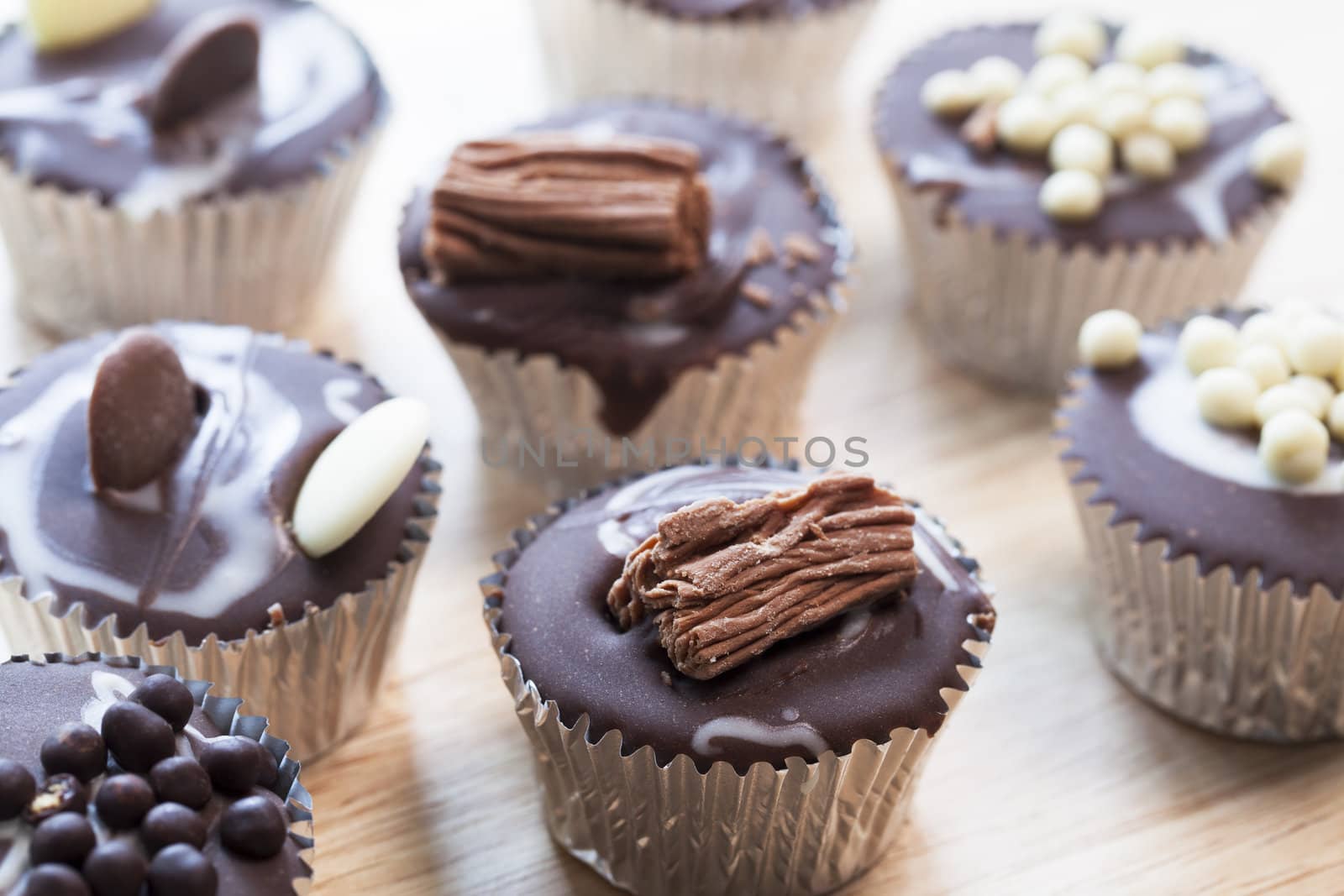 Gourmet chocolate cupcakes in silver cupcake wrappers