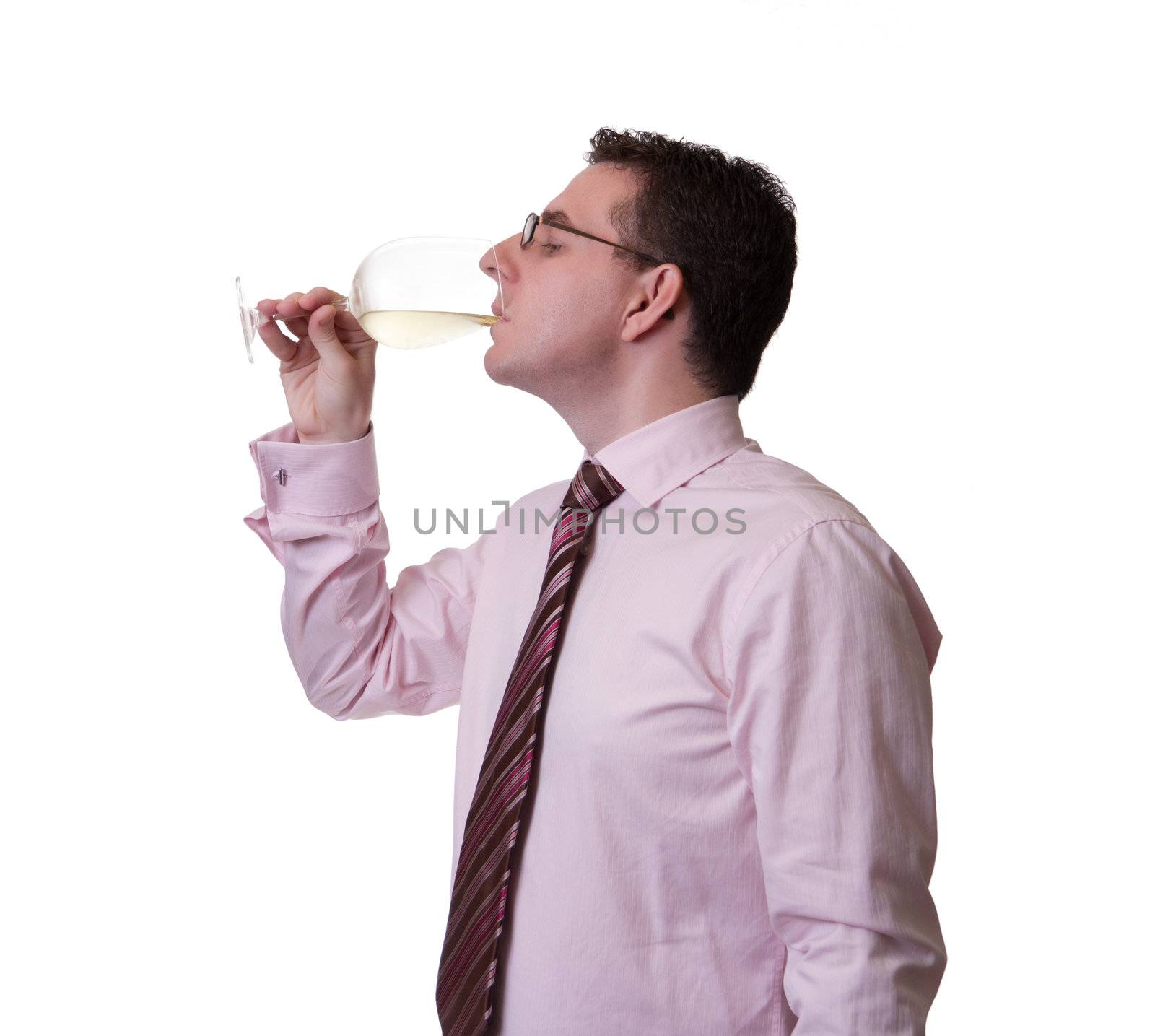 Portrait of a man with tie tasting a glass of white wine