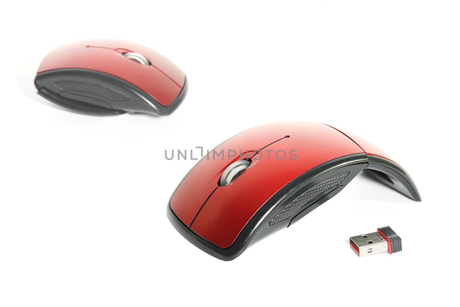Highly portable, red wireless optical mouse with USB wireless dongle.