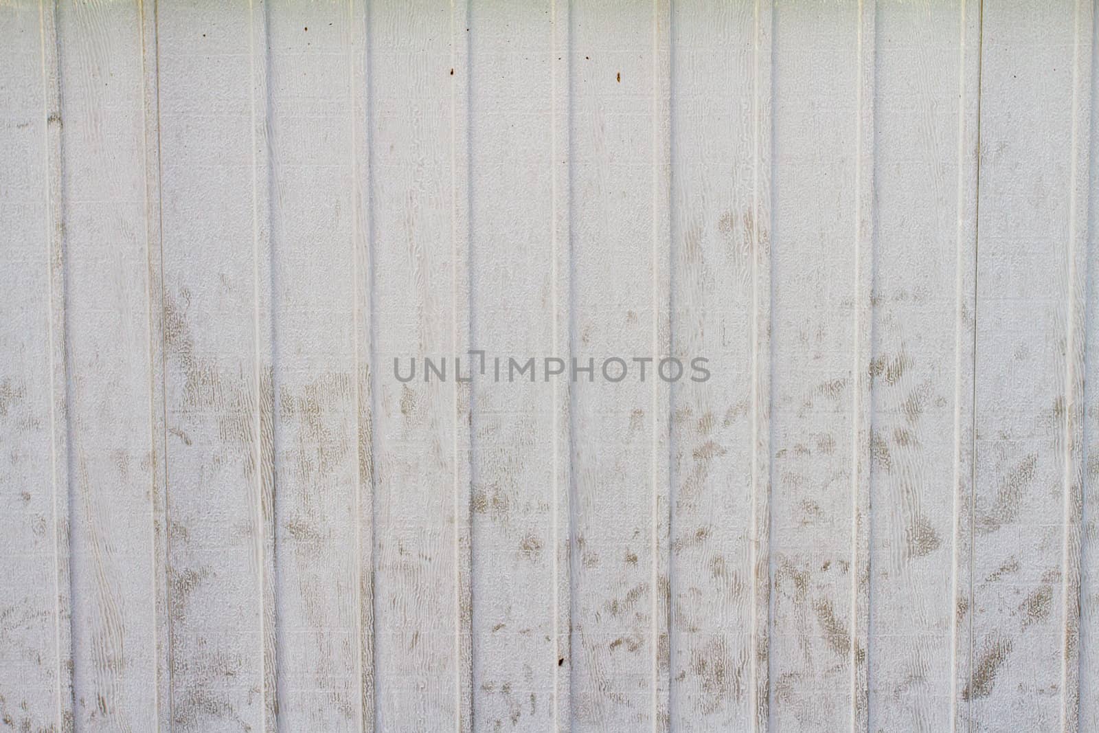 A striped wooden painted backgroudn with some dirt and scuffs on it.