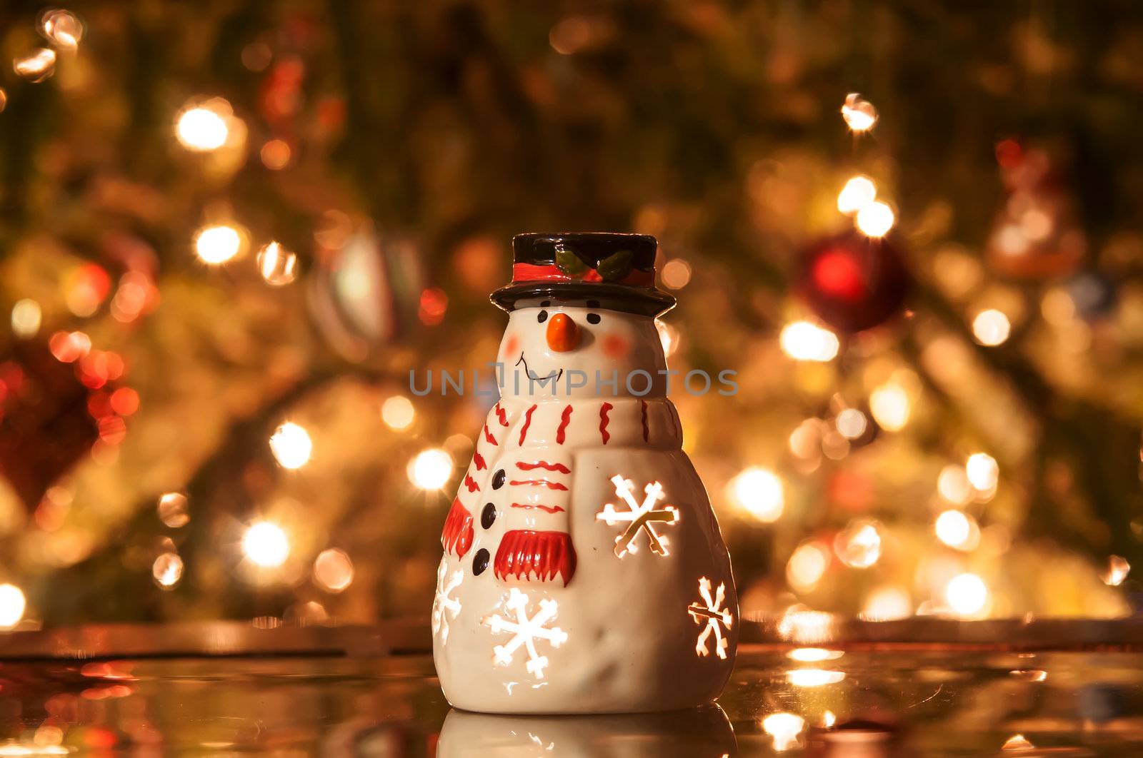 Festive snowman with Christmas light background