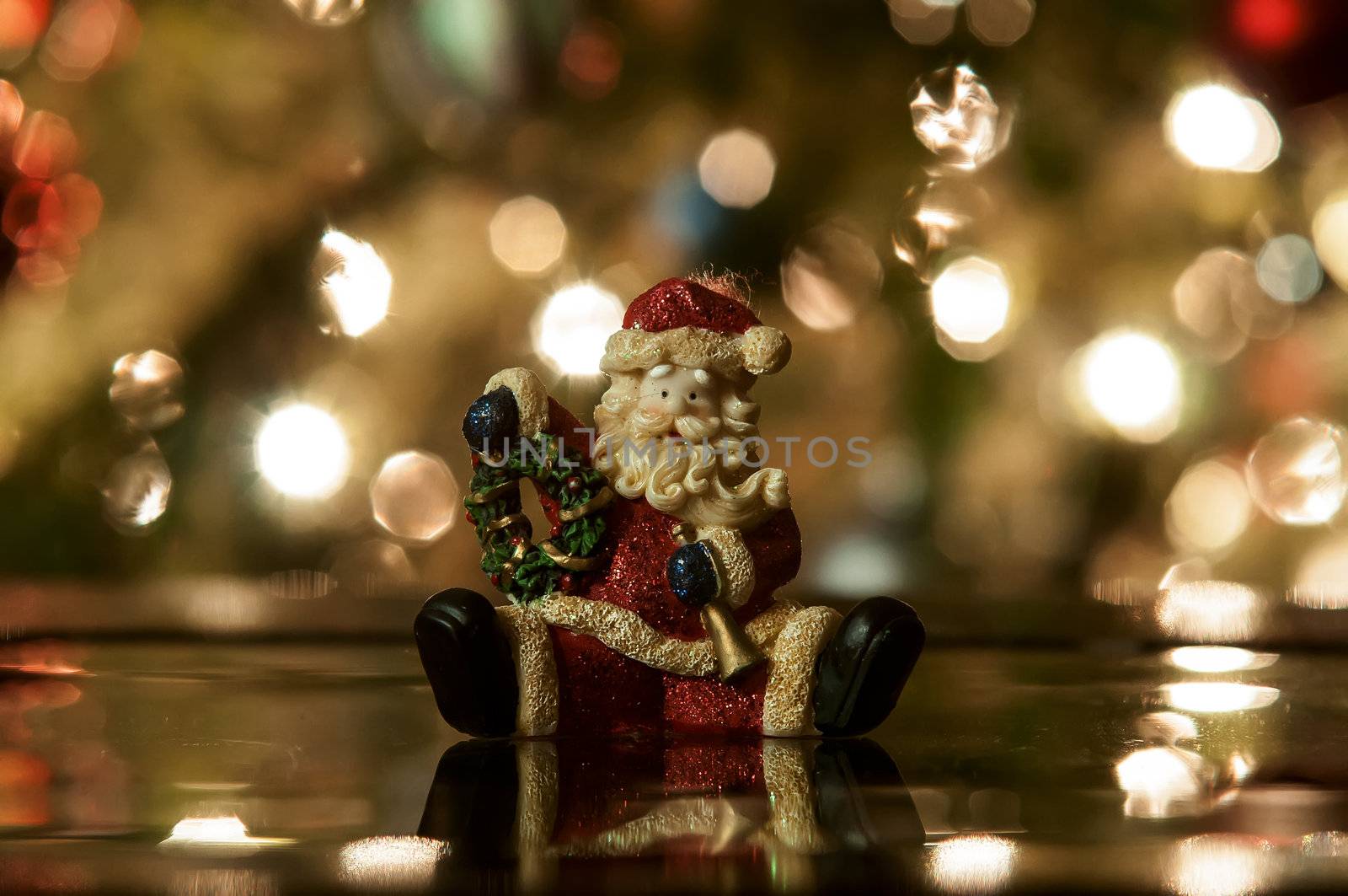 Festive santa with Christmas light background