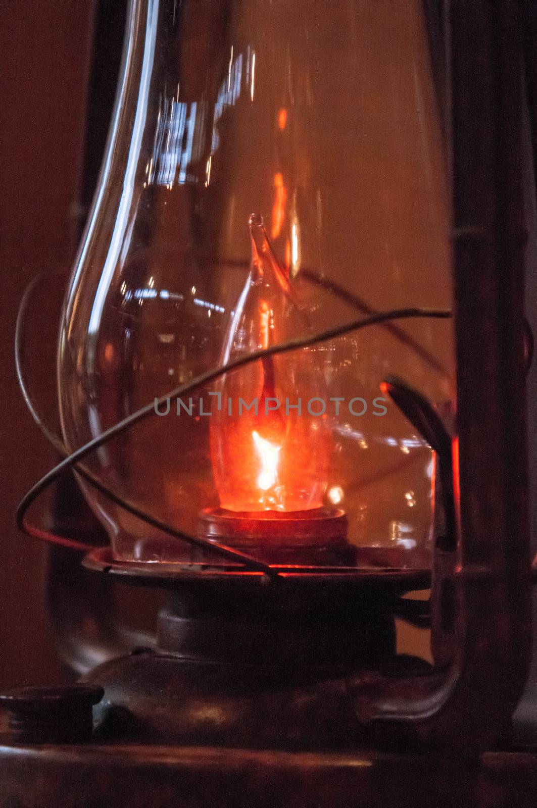 Old fashioned lantern in darkness.