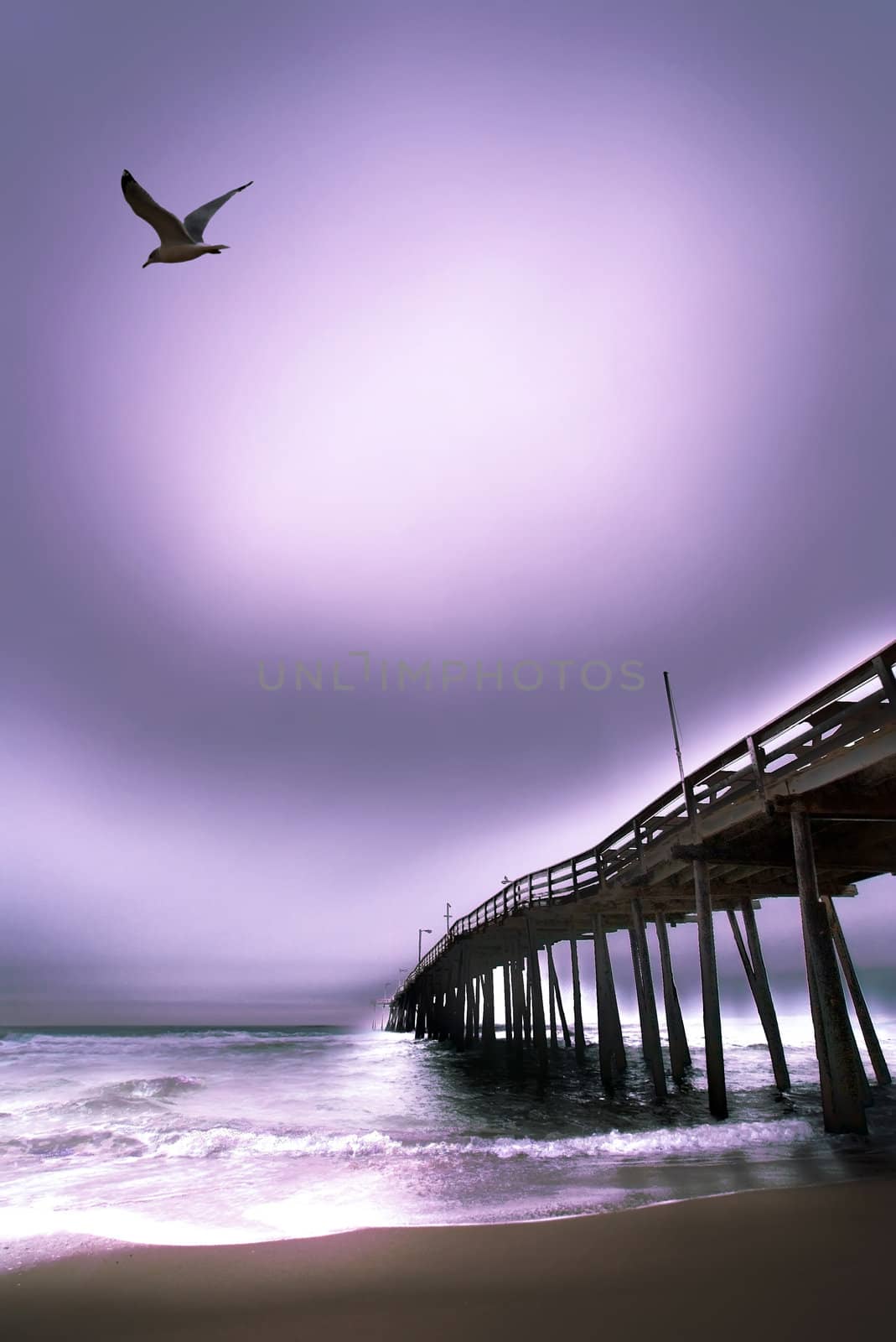 Moody picture of the outer banks Beach fishing pier at dawn