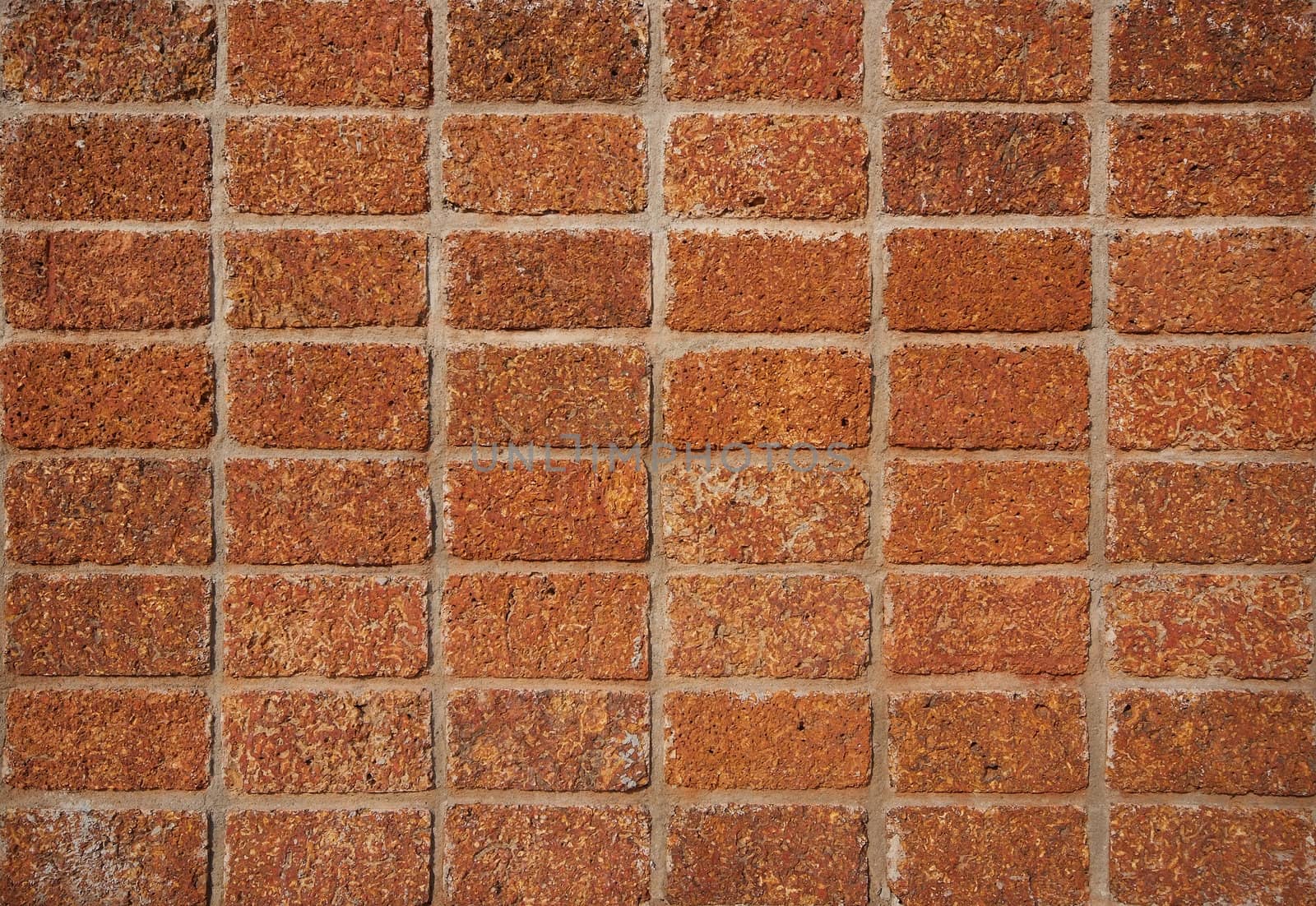 pattern red - brown color of modern style design decorative laterite stone wall surface with cement 
