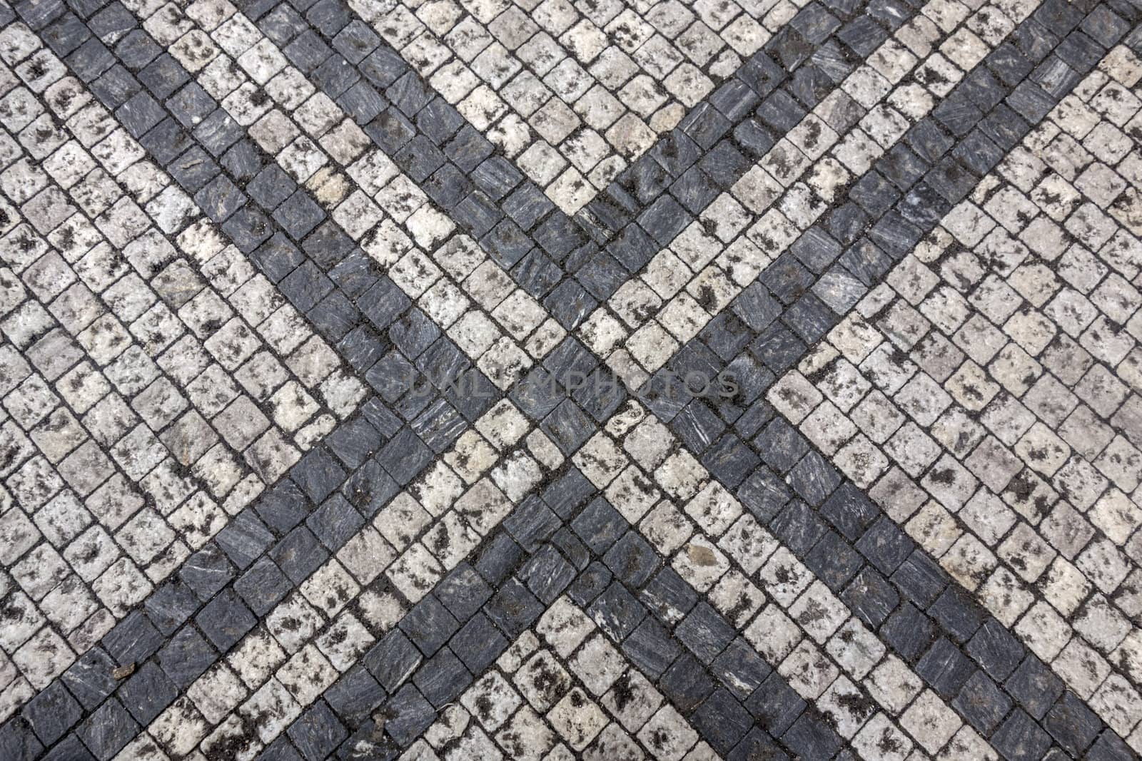 Texture of black and white stone structure road in Prague 