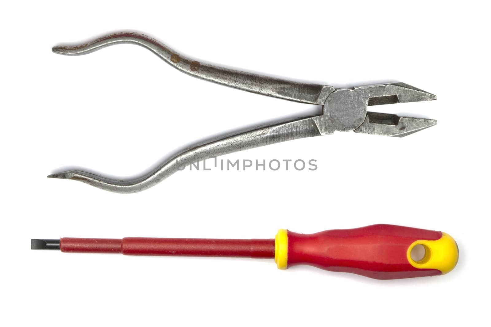 Pliers and screwdriver closeup on white background