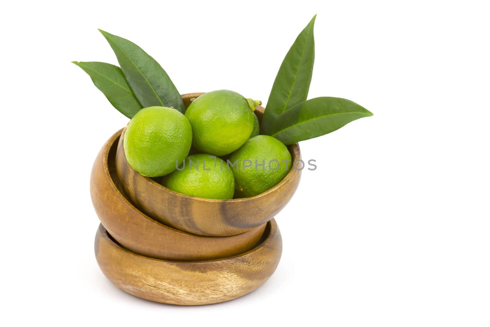 Wooden bowl filled with limes