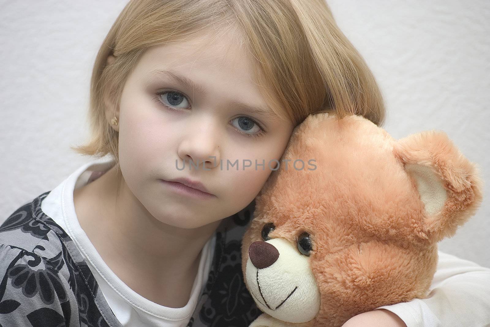 little girl with toy bear