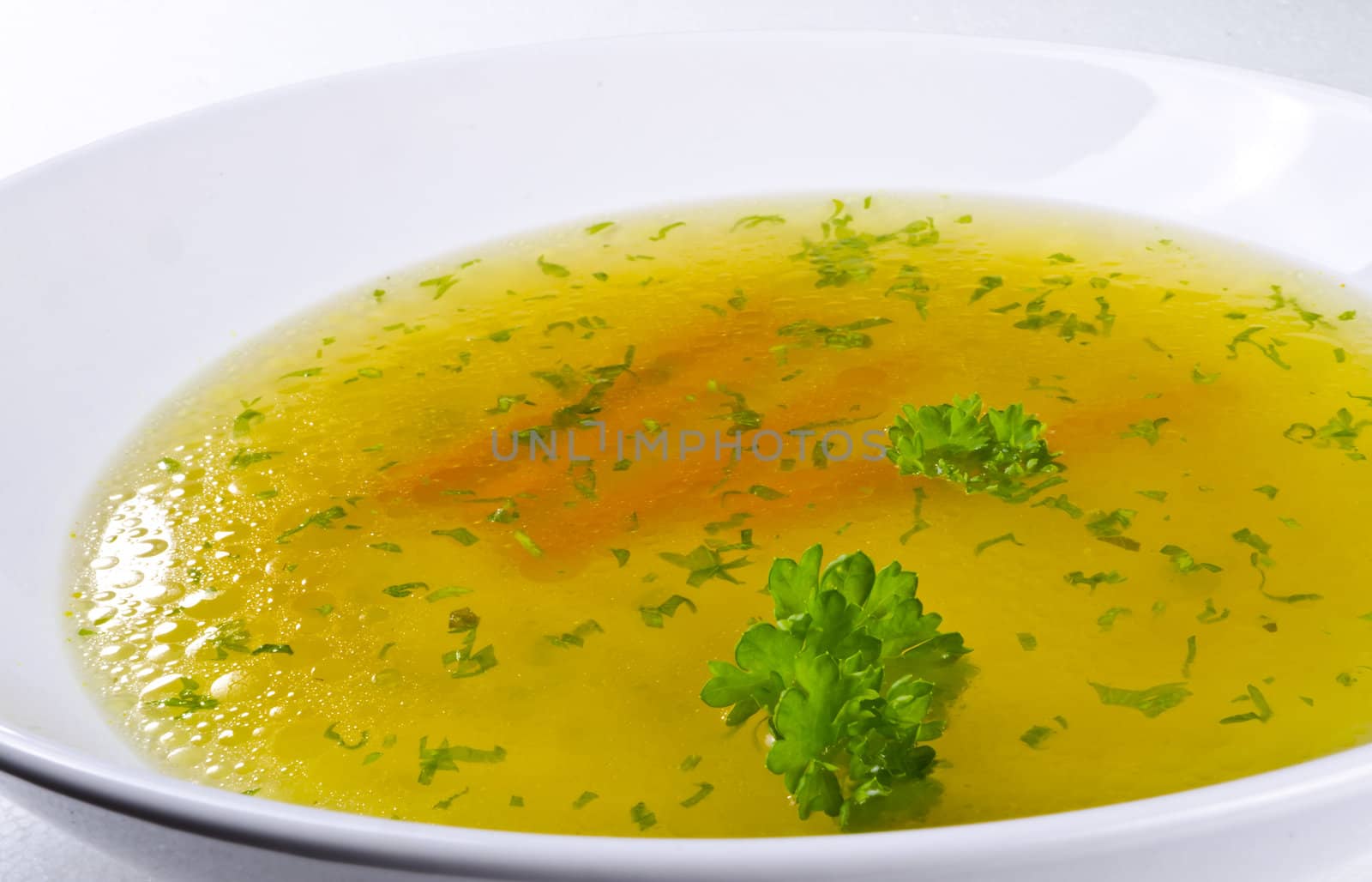 a fresh summery broth with leek onion, and carrot