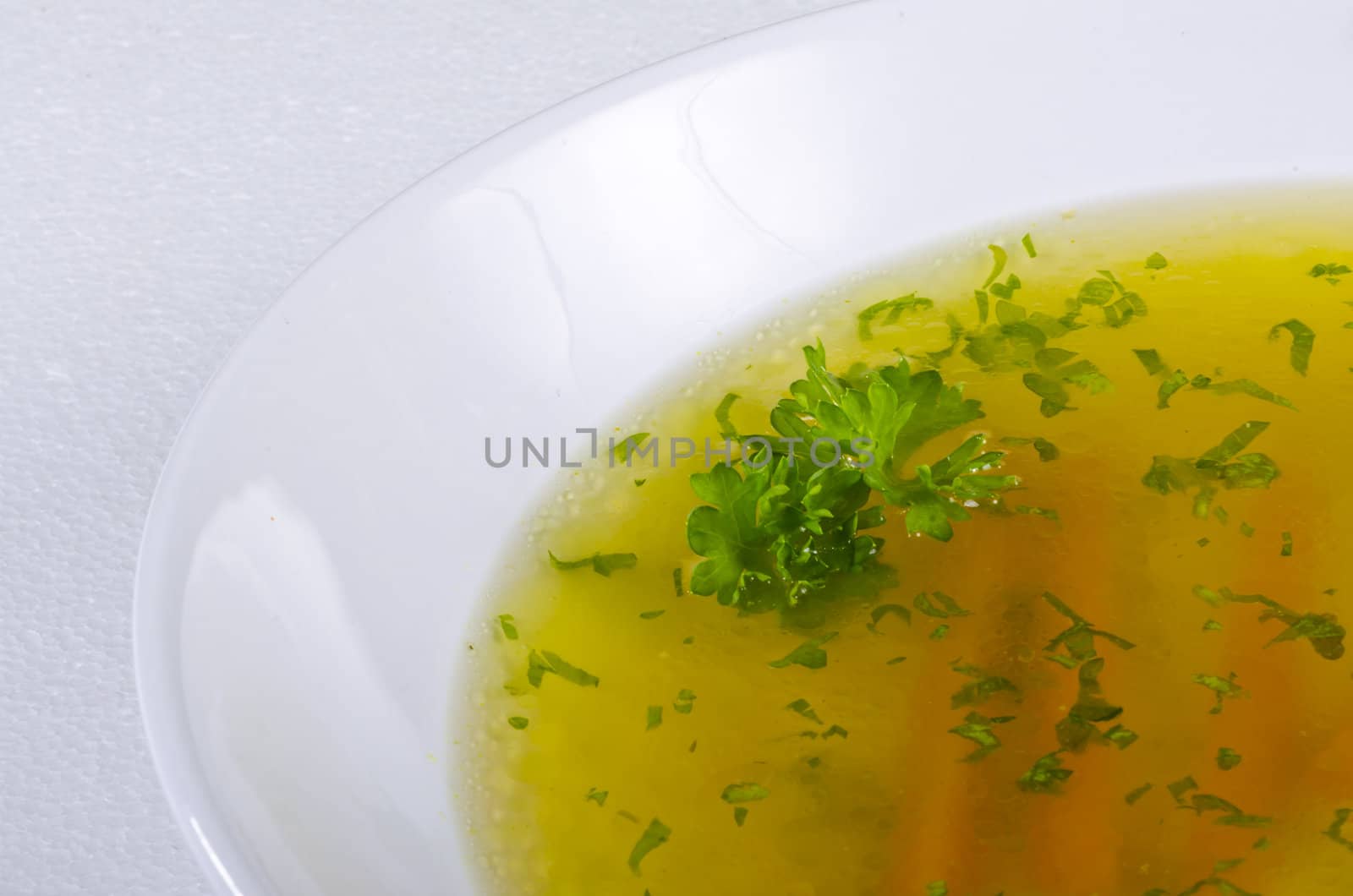 a fresh summery broth with leek onion, and carrot