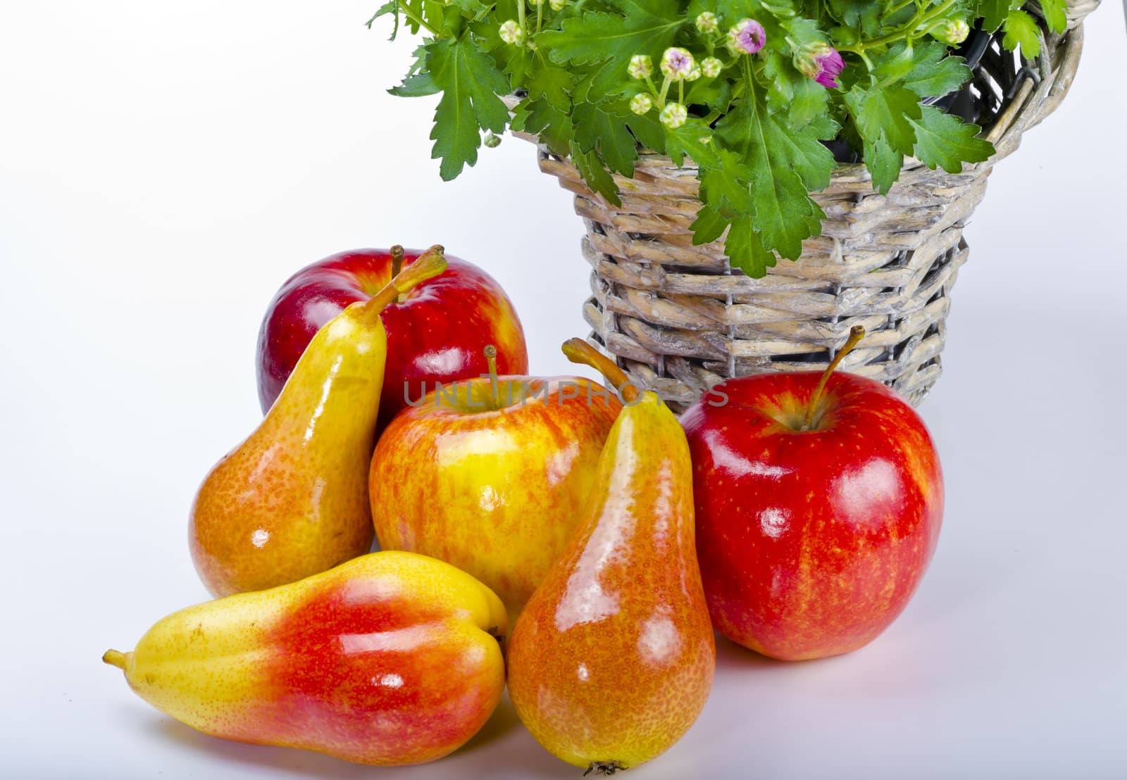 Basket with flowers and fresh fruits