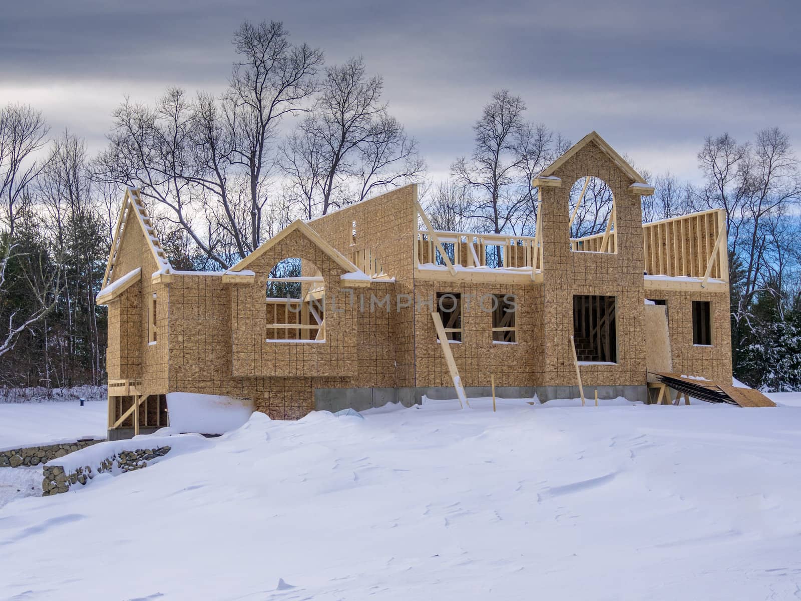 New house framing construction taking place in winter