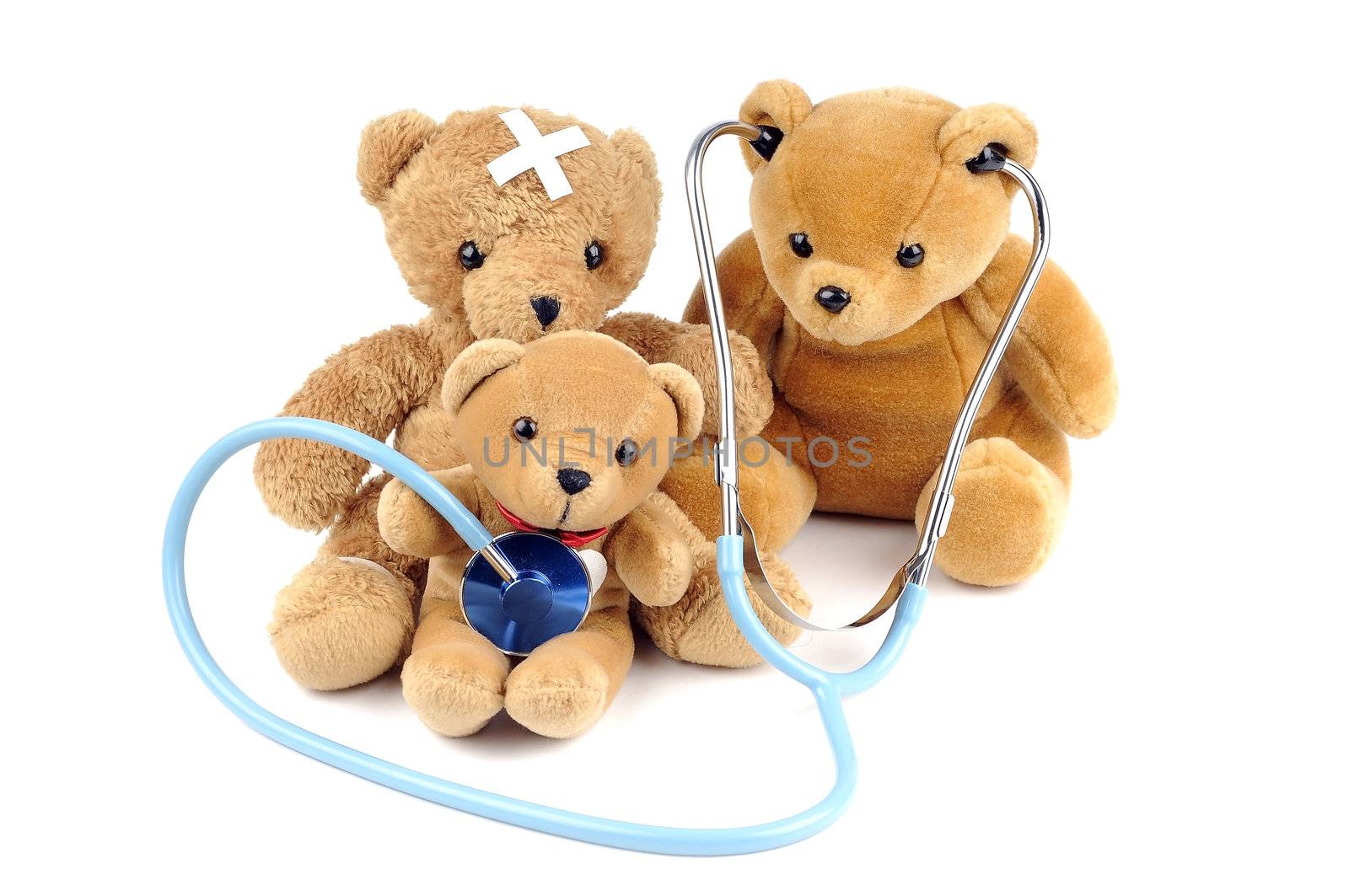 Three teddy bears and a stethoscope