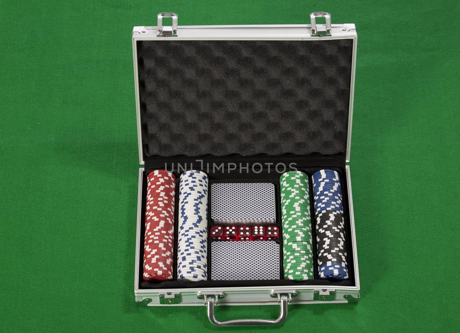 A photo of poker chips and cards in a briefcase