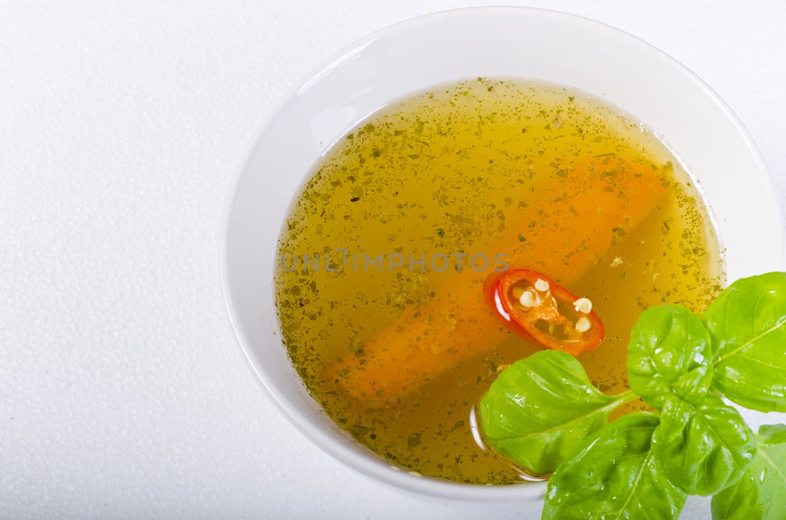 a fresh summery broth with leek onion, and carrot