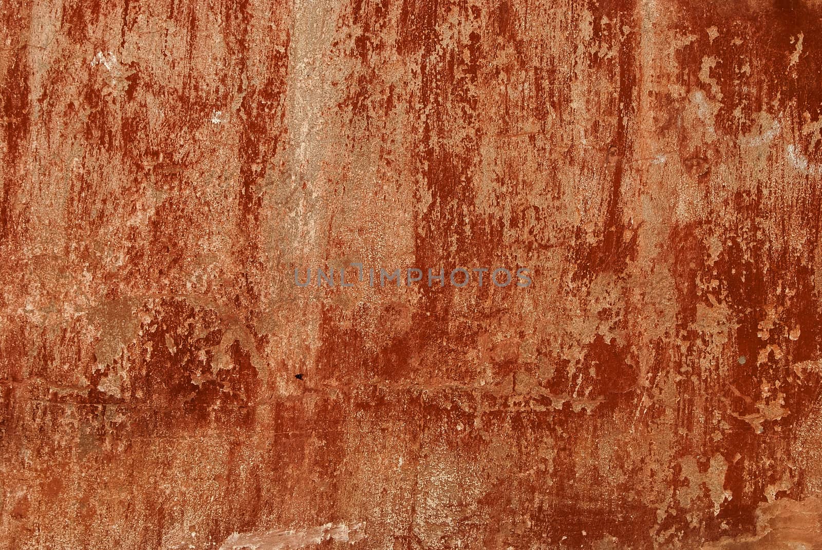Old red painted fade colors plastered house wall as background