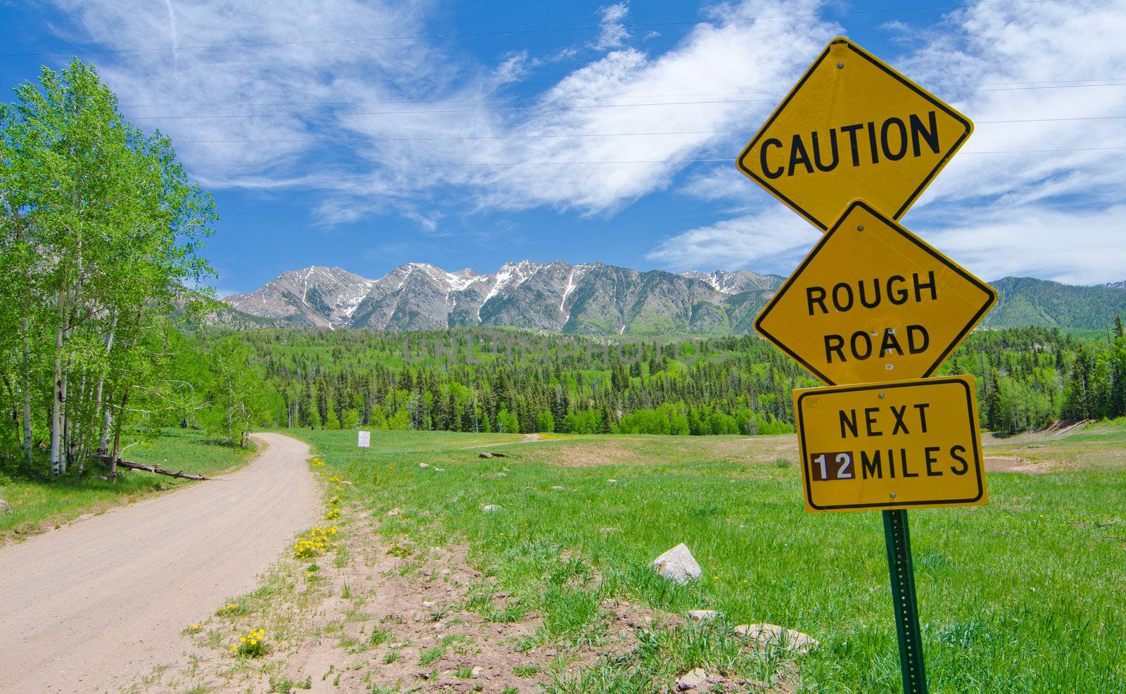 Caution: Rough Road Sign in the San Juan Mountains in Colorado by robert.bohrer25@gmail.com