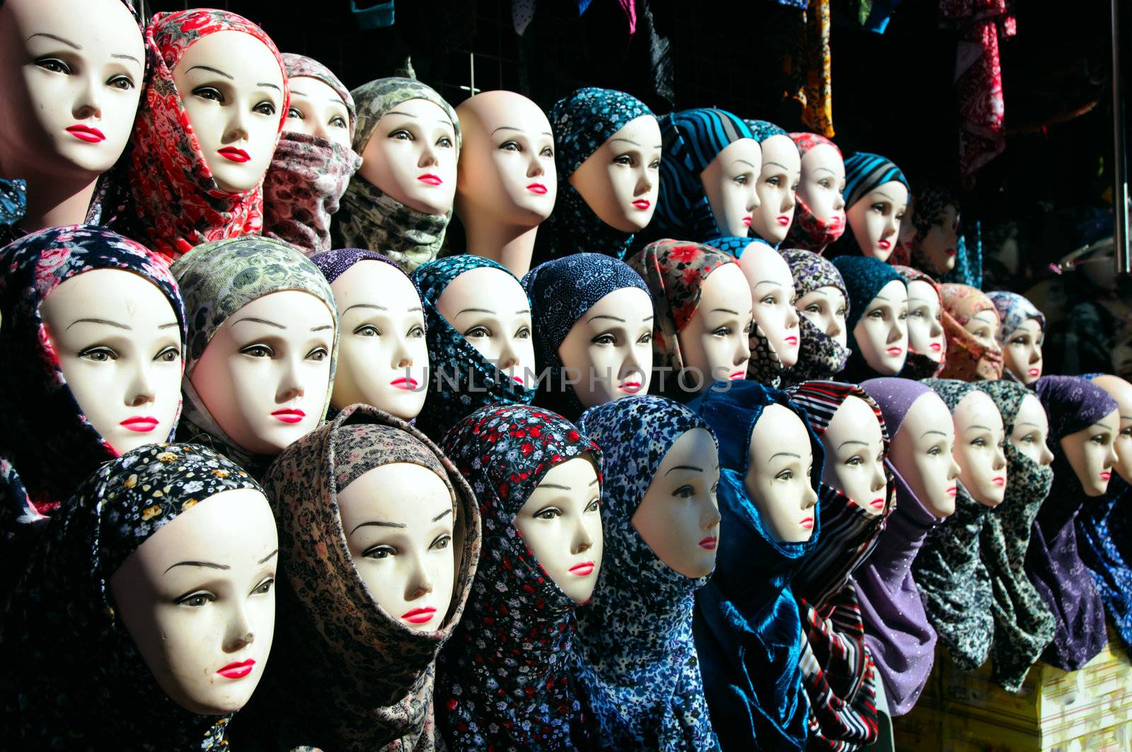 Closeup of the heads of a mannequin in hijab by tipota