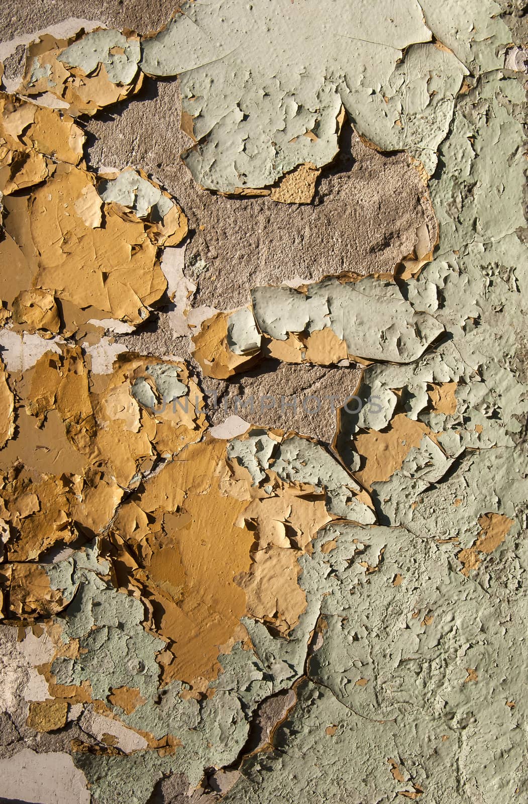 Old crumbling paint layers wall as background